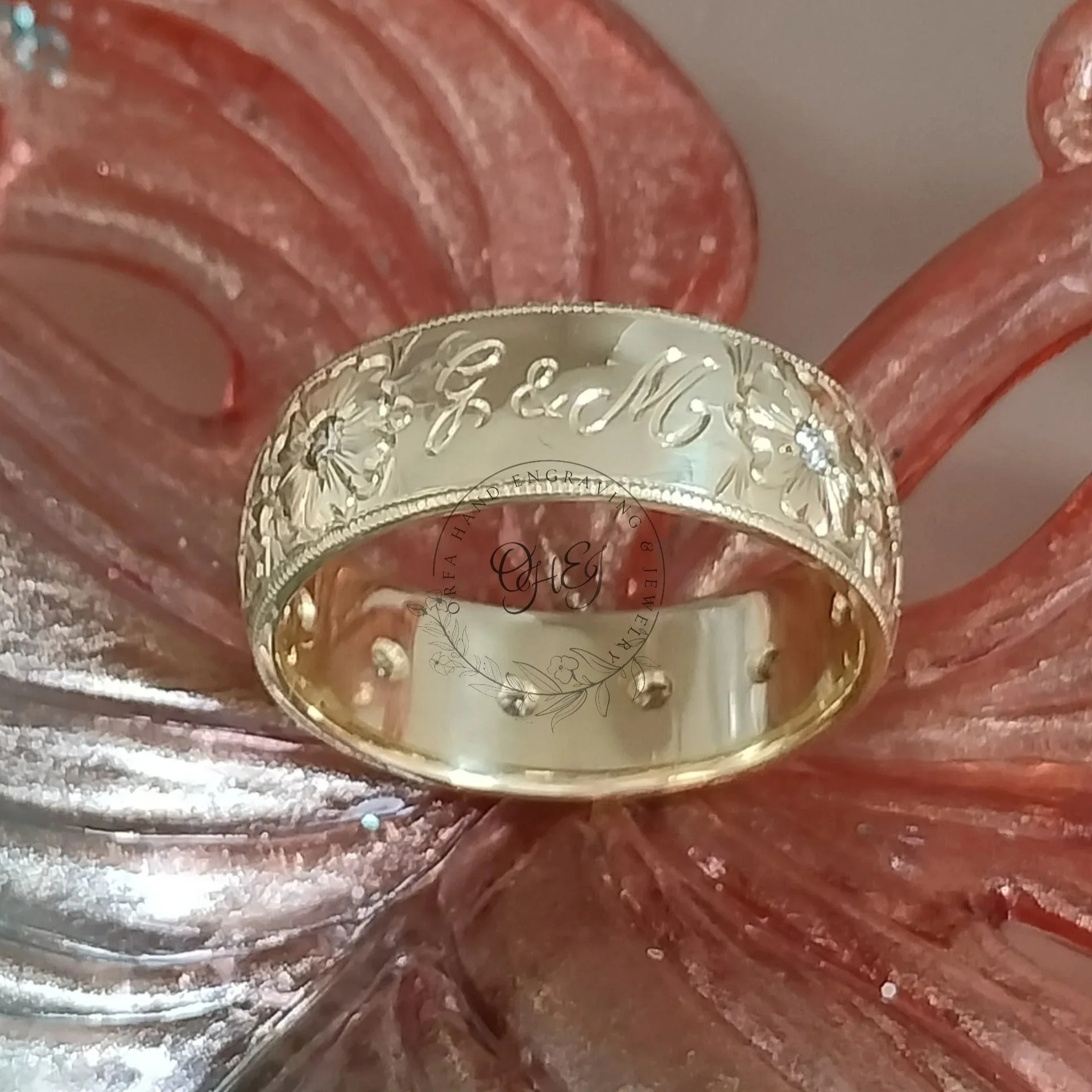 Hand engraved initials on gold cosmea wedding ring by Orfa