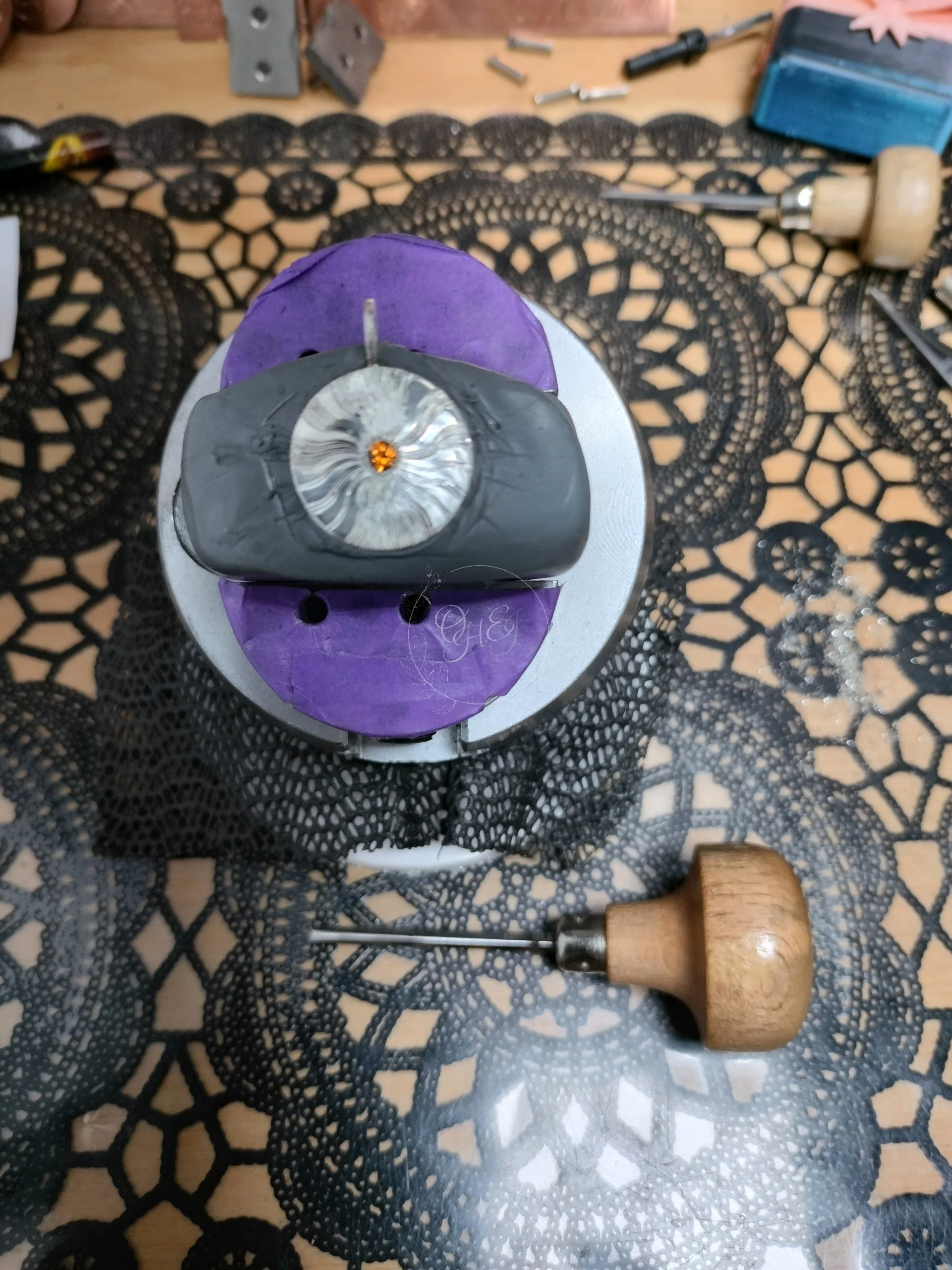 engraving proces and tools on silver sunshine pendant with gemstone