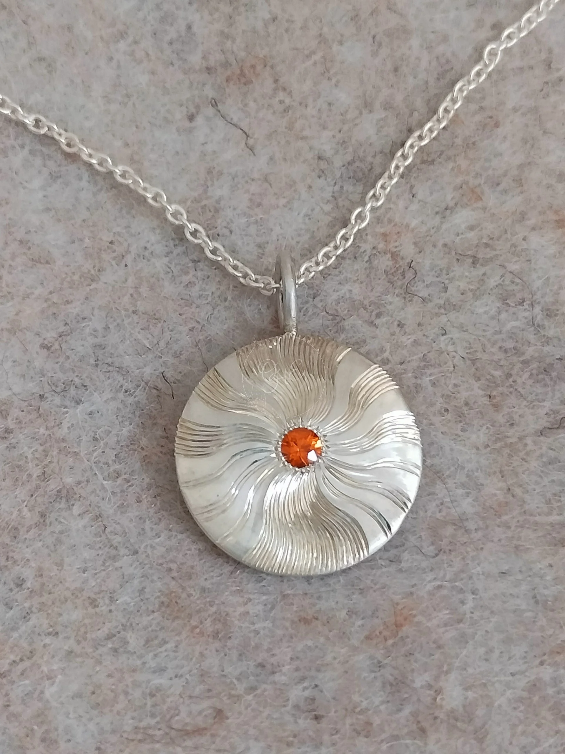 Silver sunshine pendant hand engraved by Orfa