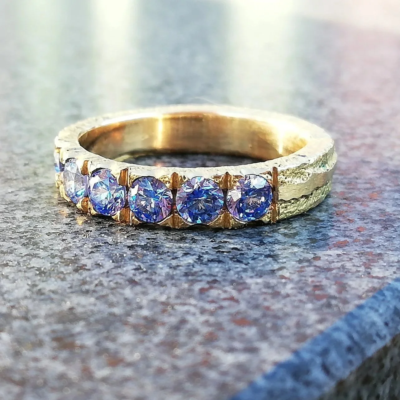 Gold ring with blue zirkonia