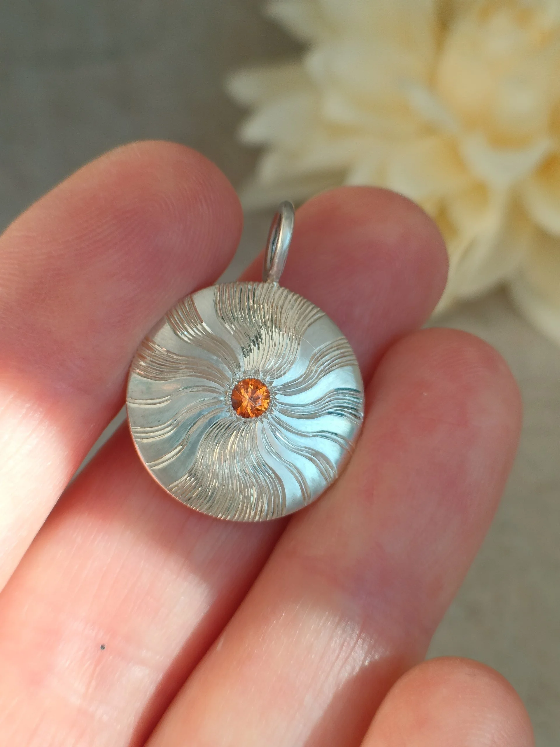 Shiny silver sunbeam with corund gem made by OrfaHandEngraving