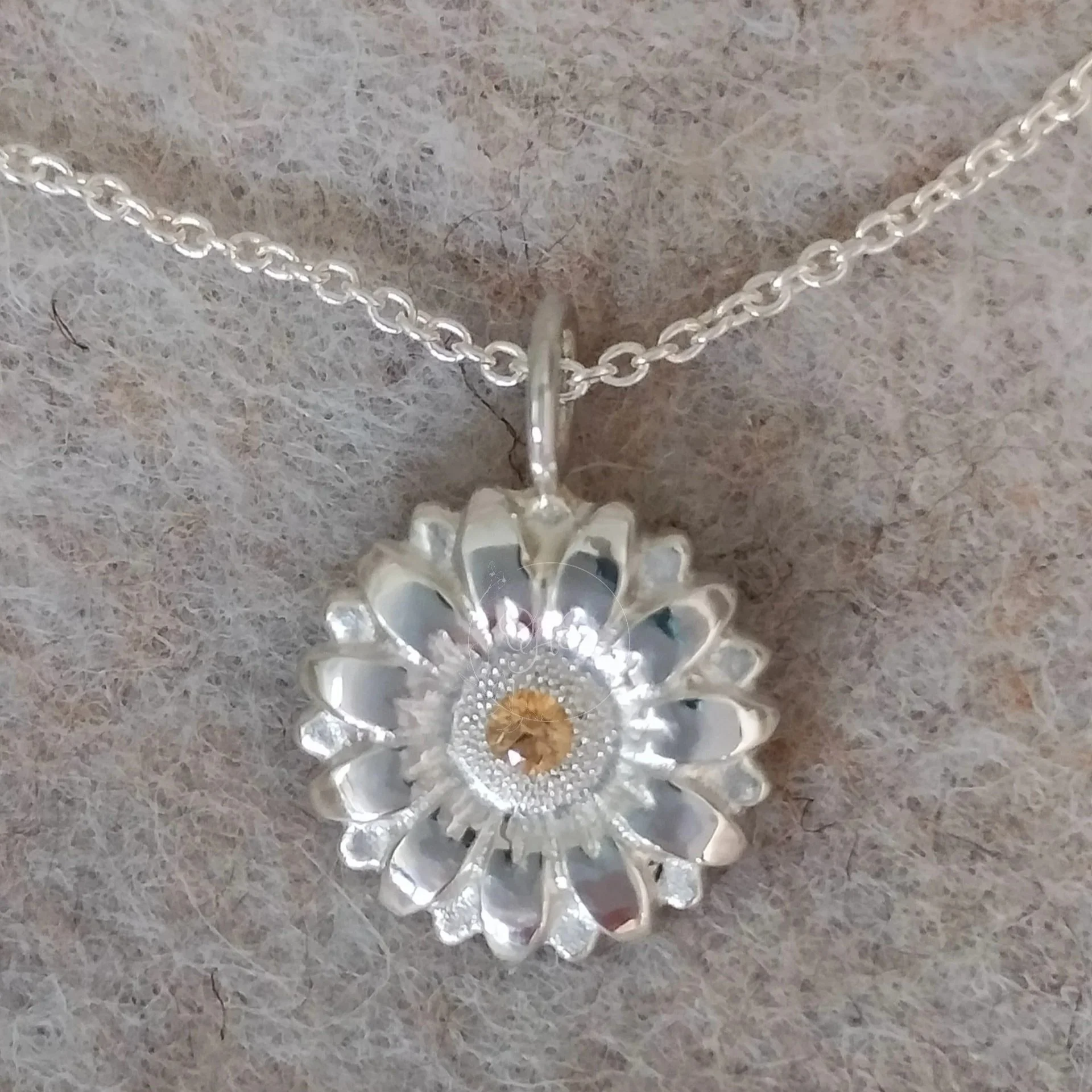 Sterling sunflower pendant with yellow gemstone
