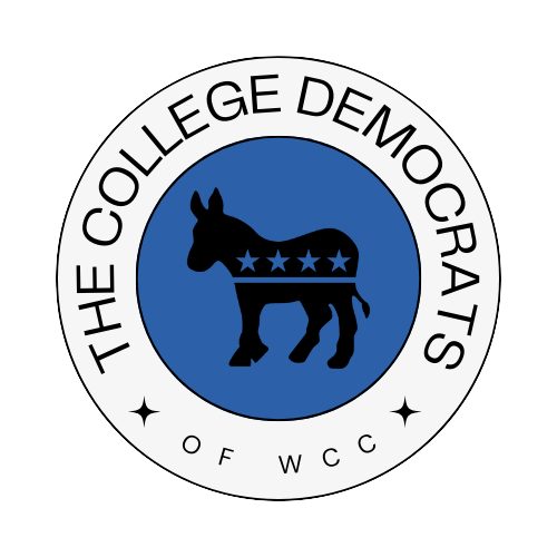 A circular logo with a dark blue donkey figure in the center, featuring a band with stars across its body. The outer ring has the text 'THE COLLEGE DEMOCRATS' at the top and 'OF WCCC' at the bottom, with small star icons on either side.