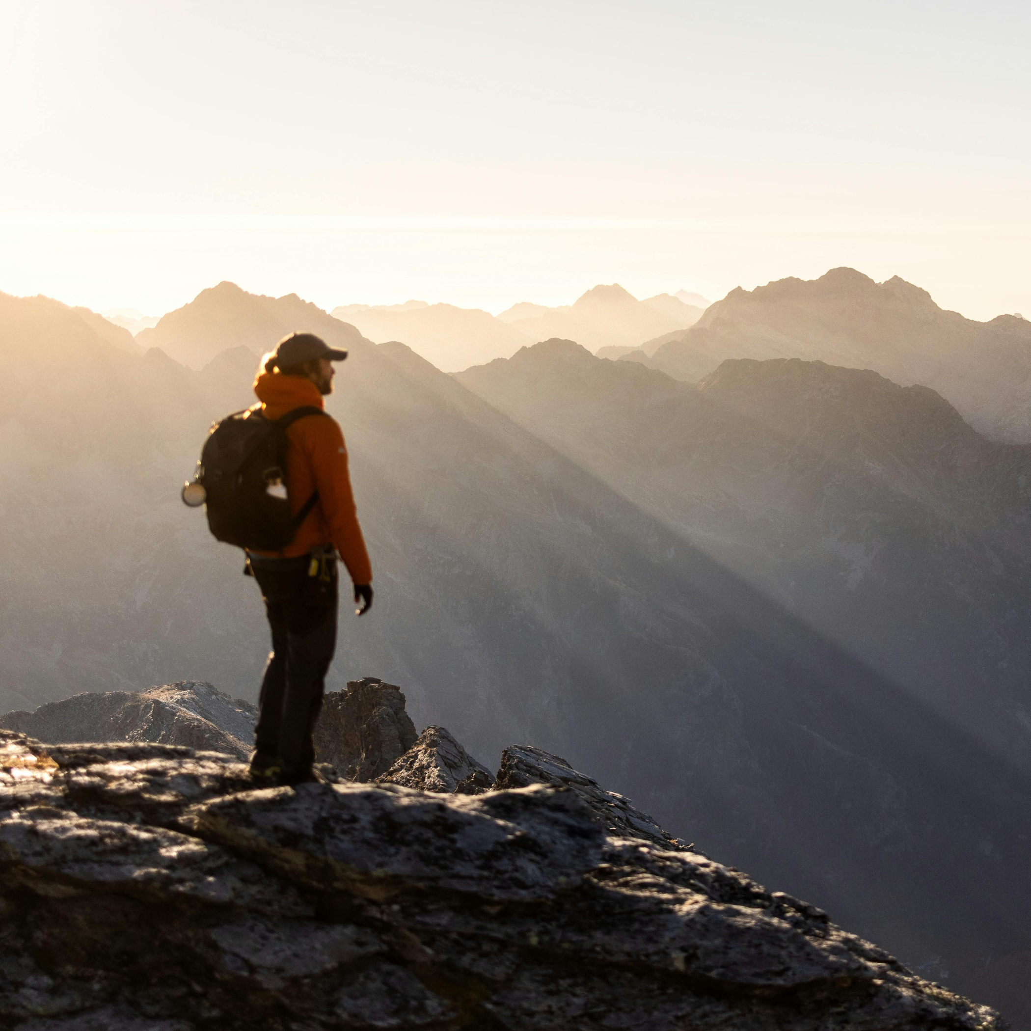 Hiker on mountain top in the morning