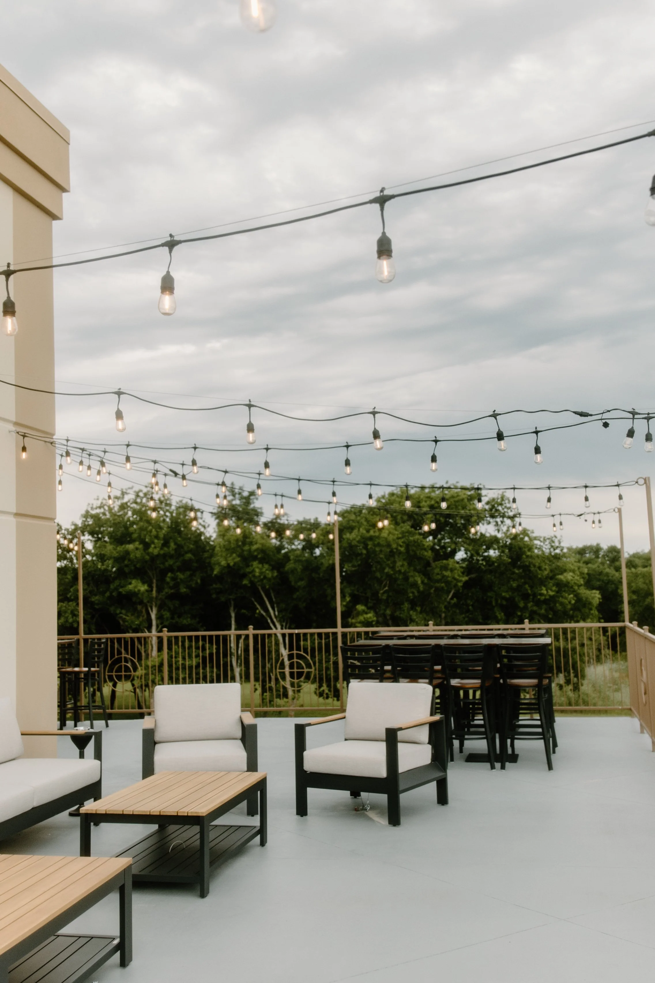 Outdoor lookout patio with string lights at The Grand View Mansfield event venue