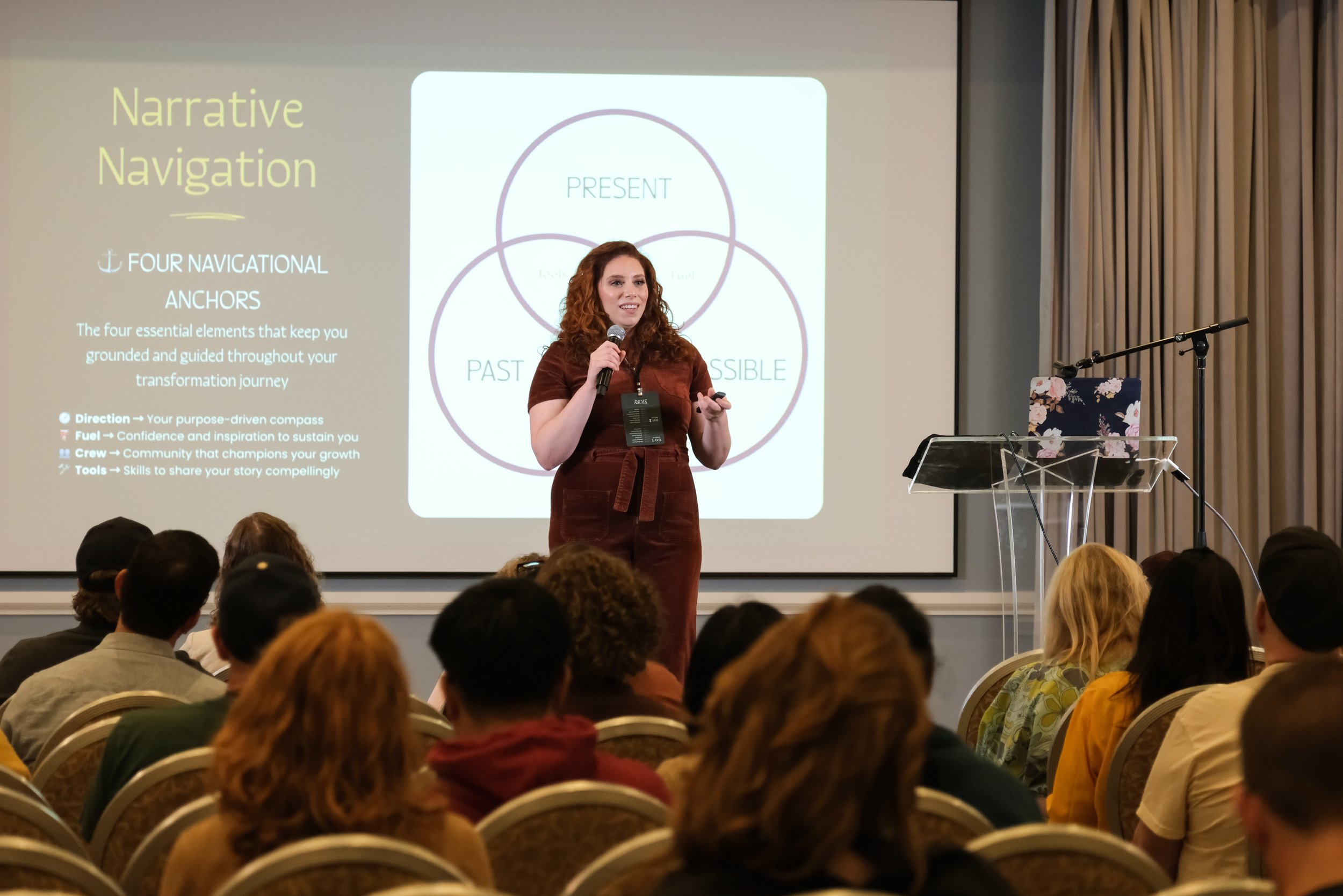 Liz Morrison leading a storytelling workshop, presenting the Narrative Navigation framework to a full room