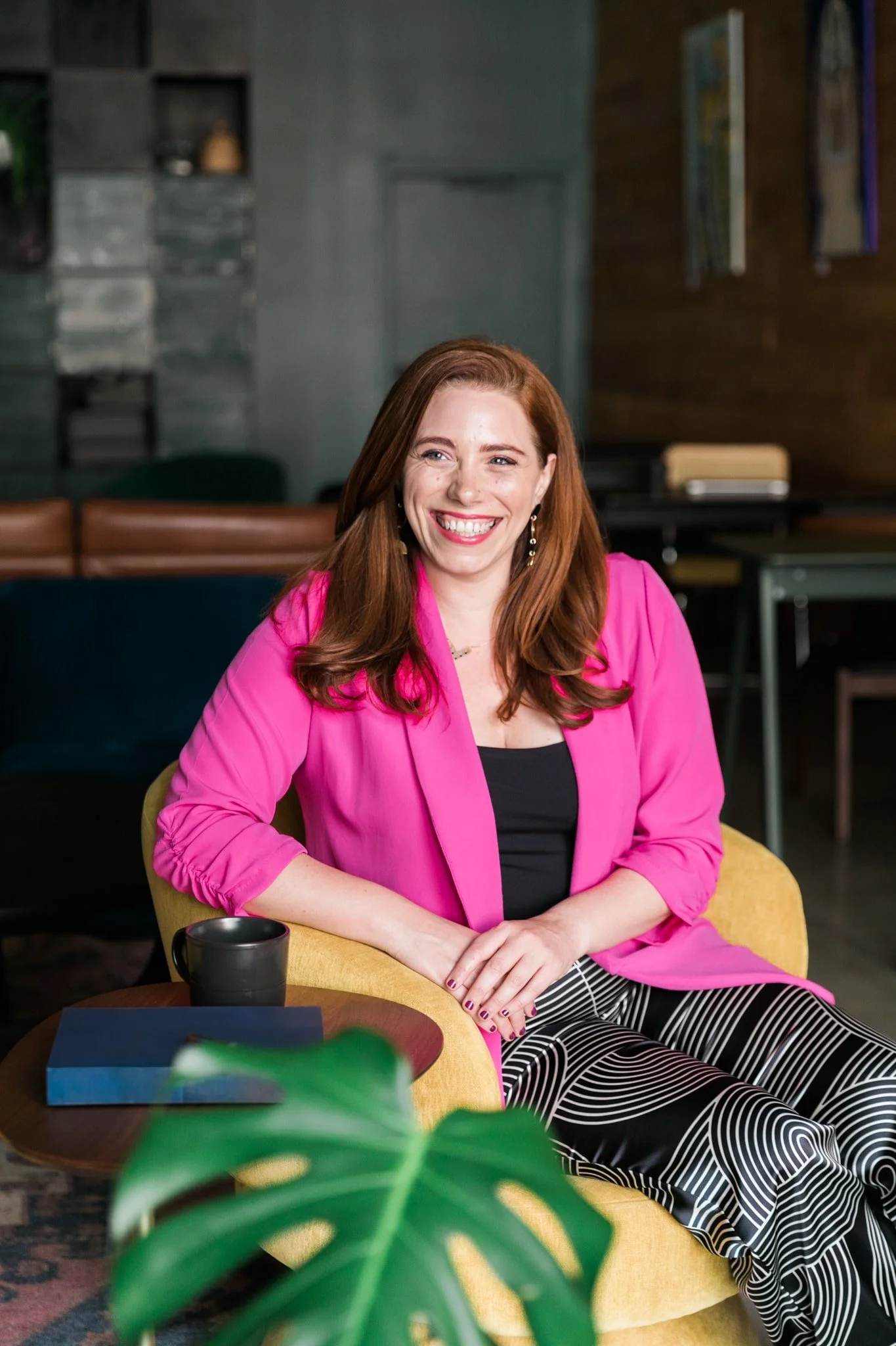 Liz Morrison, Story Coach, smiling in a pink blazer