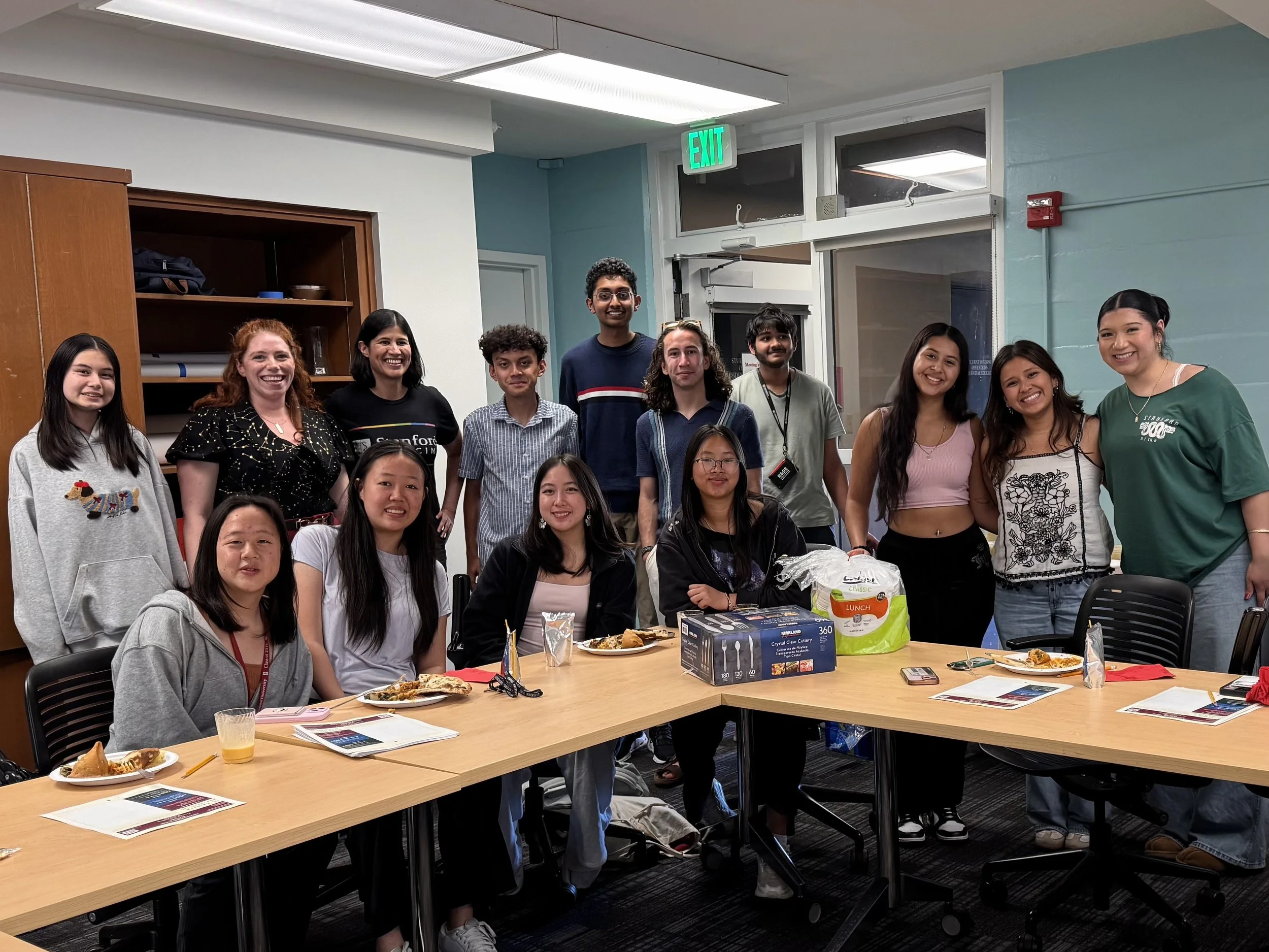 Stanford students around U-shaped tables after a storytelling workshop