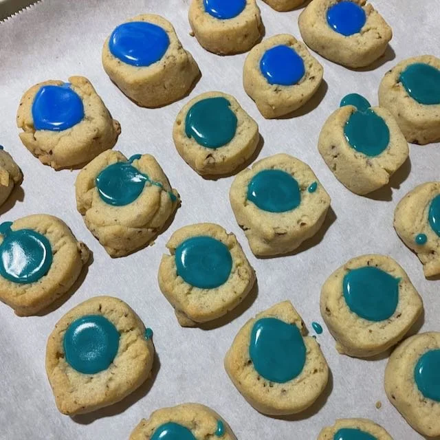 Thumbprint cookies with blue and green frosting.