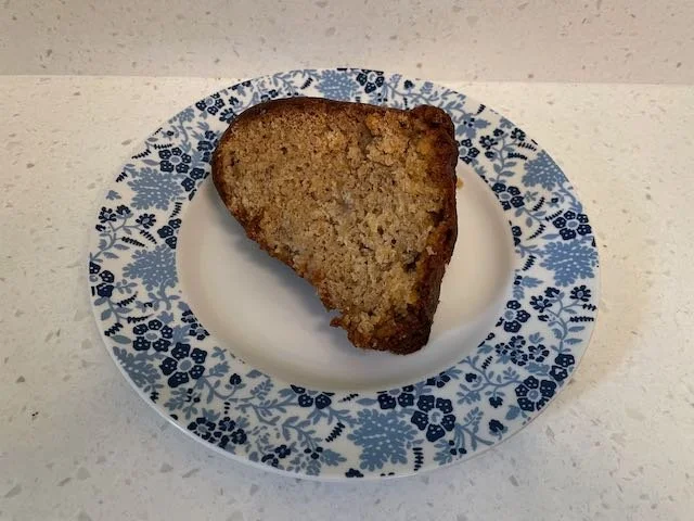 Doctor Bird Cake on plate with blue floral border.