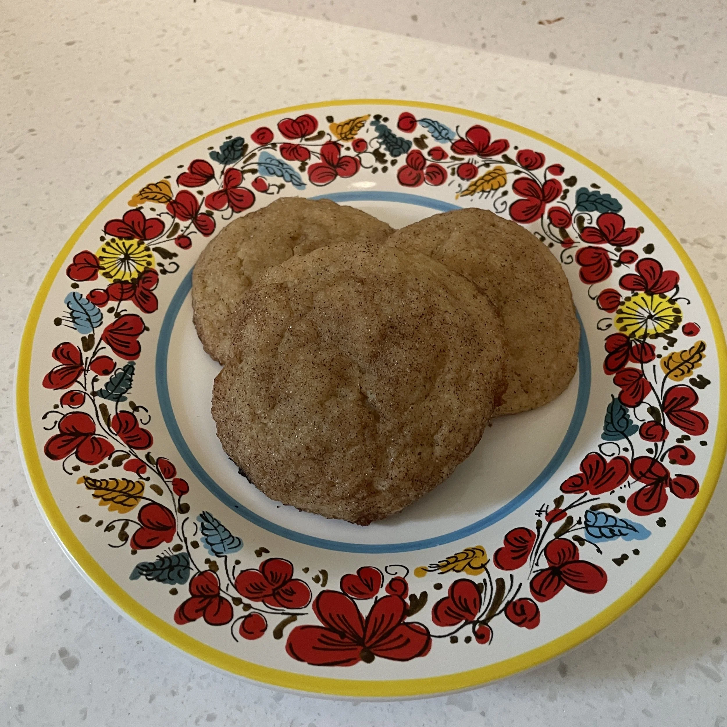 Banana snickerdoodles on brightly colored plate. Baked by Bethesda bakery.