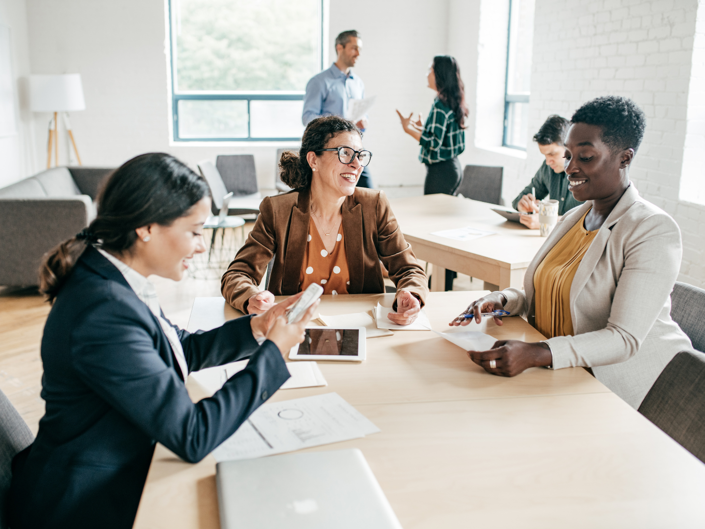 Diverse Professional Woman in a meeting talking