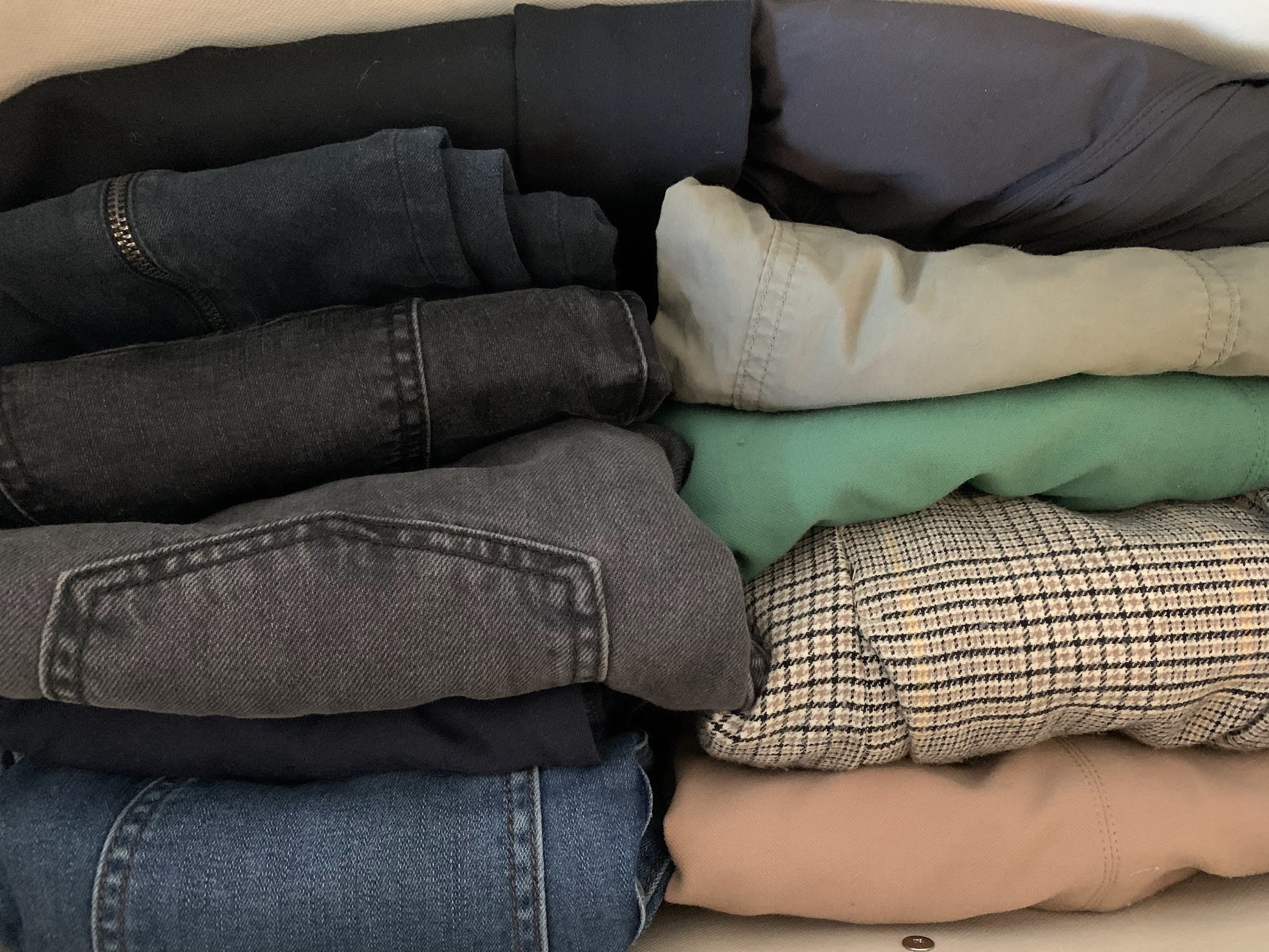 Organized drawer with pants folded in KonMari style.