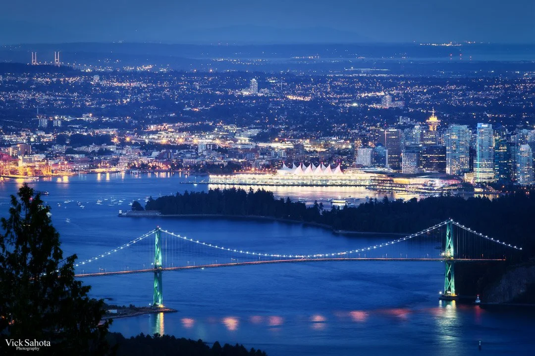 Downtown Vancouver skyline and Lions Gate Bridge at dusk, seen from the Cypress lookout.