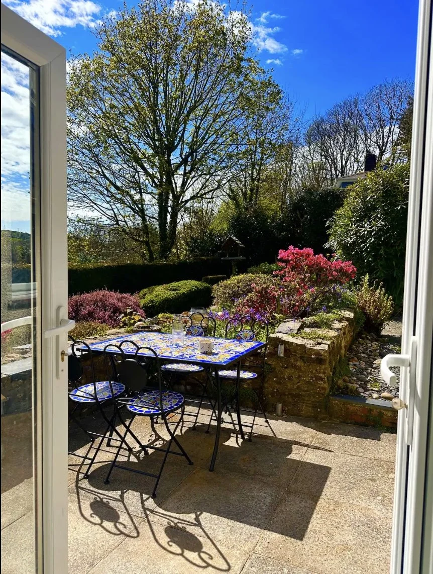 The Leap's secure garden is accessed immediately from the kitchen through French doors, and overlooks Little Haven's beautiful wooded valley. 