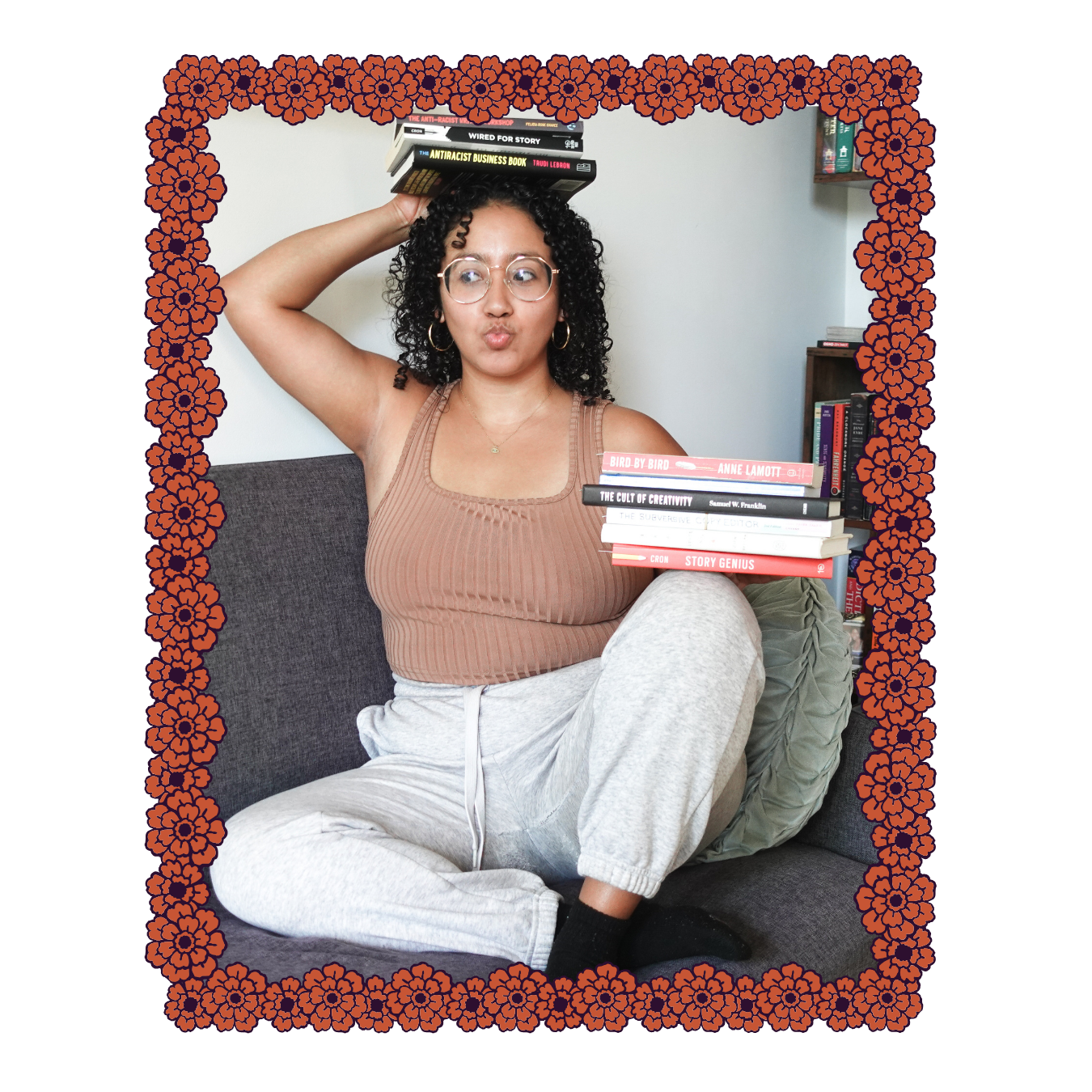 Book coach Sabrina sits on a sofa balancing one small stack of books on her knee and another on her head. She makes a fish face and looks away from the camera.