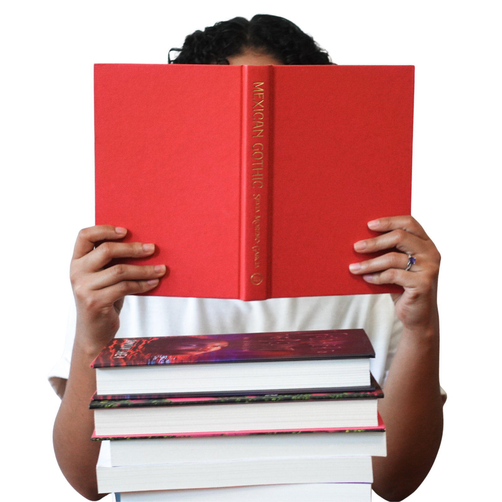 Book coach Sabrina holds up an uncovered copy of Mexican Gothic by Silvia Moreno-Garcia