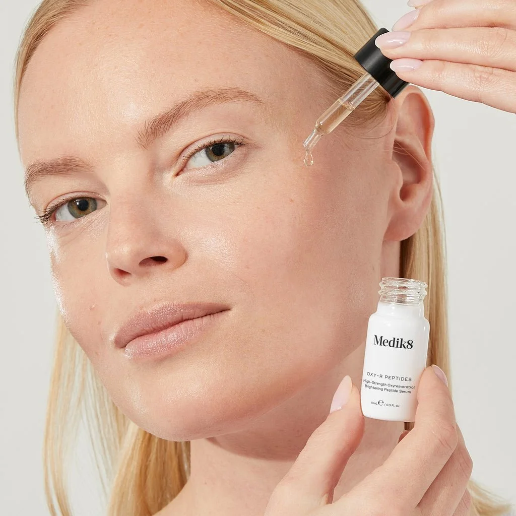 OXY-R PEPTIDES BEING USED ON A FACE.jpeg