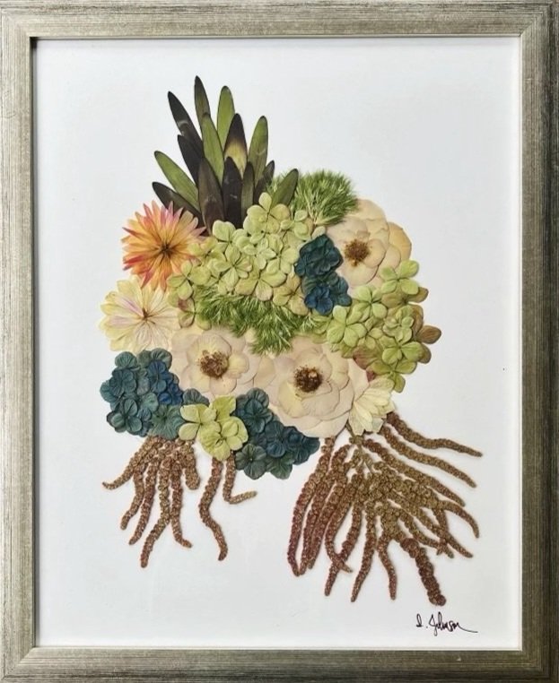 Green, blue, and neutral colored flowers in a 16x20 frame
