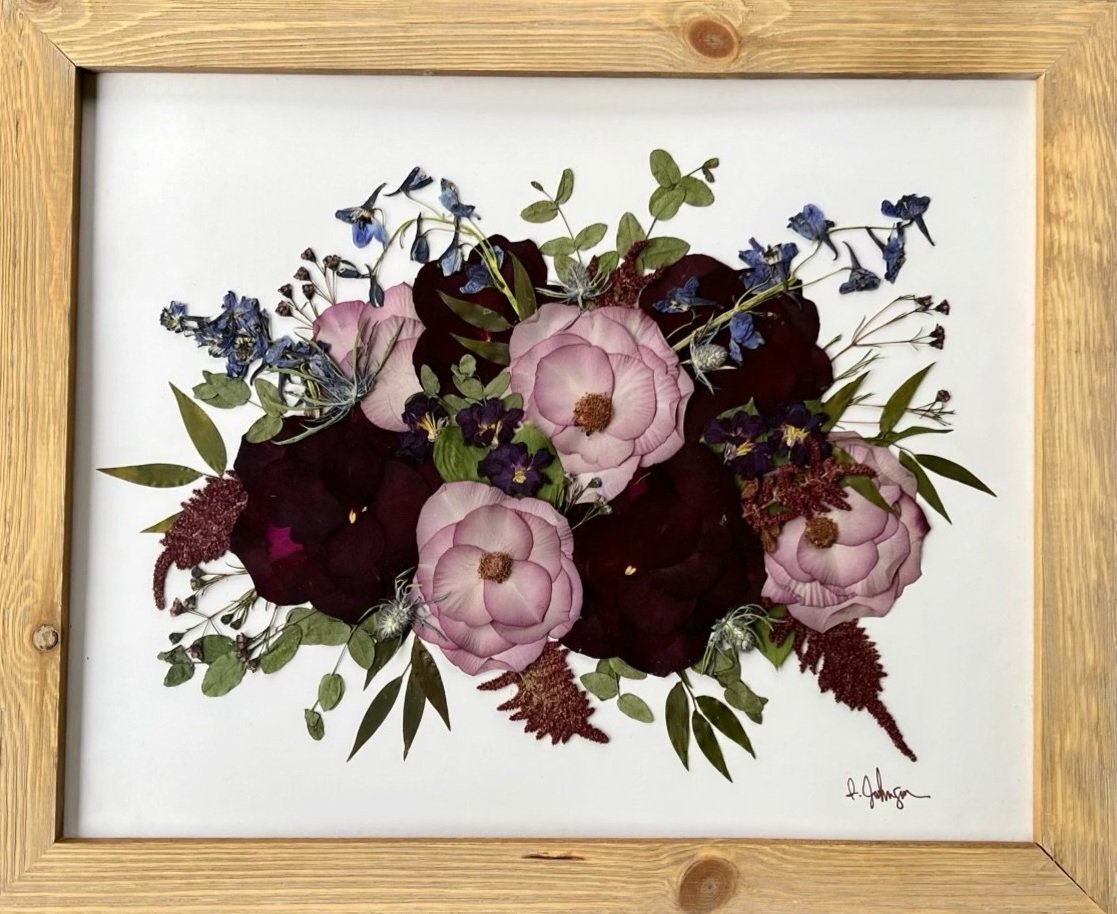 Pink and purple flowers preserved in a 16x20 frame