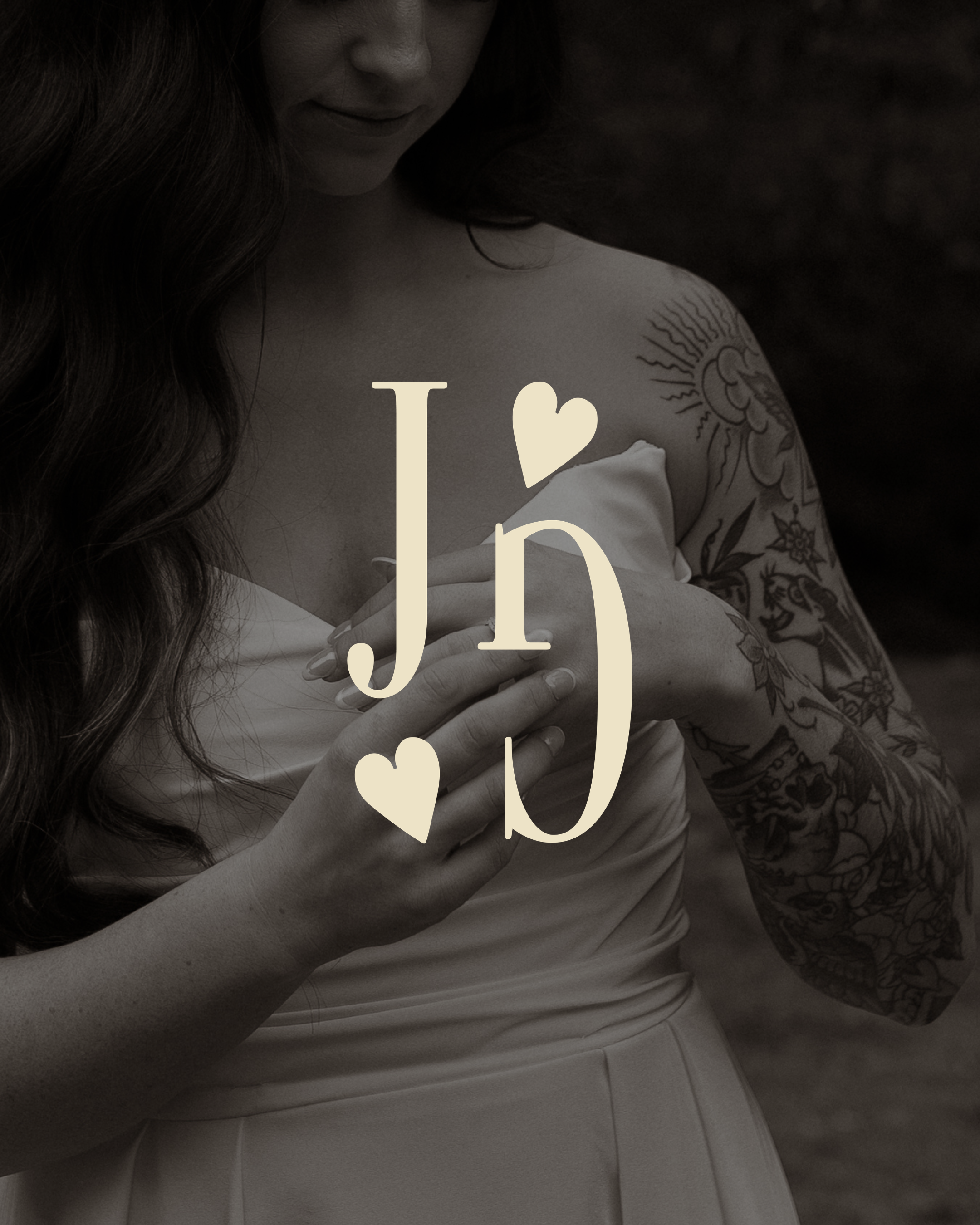 Close-up of a woman with long hair, tattoos on her arm, and her hands crossed over her chest, with a text overlay reading 'I ❤️ u'.