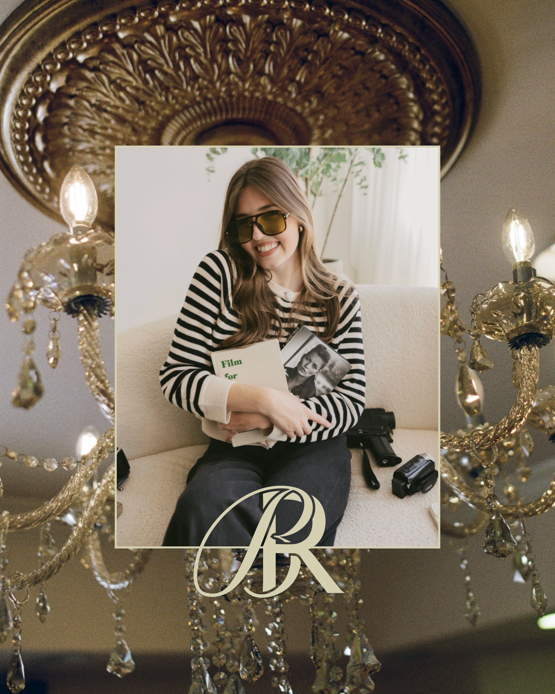 A woman with long wavy hair, wearing glasses with yellow-tinted lenses and a black-and-white striped shirt, smiling and holding a book, sitting on a couch with a curtain and a potted plant behind her. The photo is overlaid with a decorative letter 'B' and a square frame.