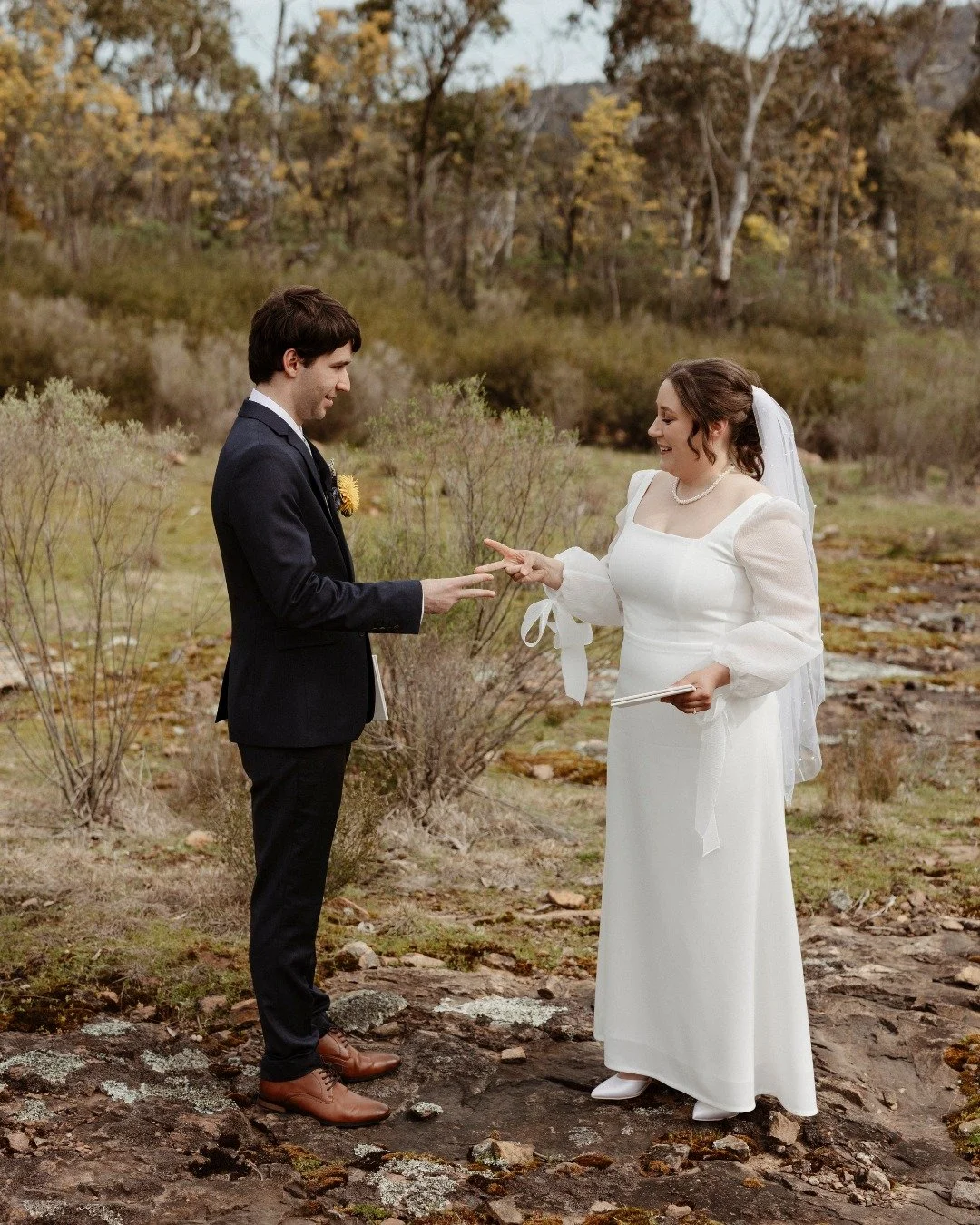Michelle & Brendan’s wedding at @canobolasdancehall was pure heart — relaxed, sweet, and full of joy. With florals of native proteas and yellow paper daisies, a glowing sunset over the dam, and the kind of love that makes everyone smi