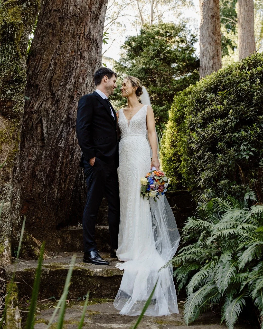 Liz and Chris wanted a day that felt like them &mdash; simple, real, and full of heart. They found it at Breenhold Gardens @breenhold, Mount Wilson, standing beneath a tree of soft blossoms, surrounded by family and friends who helped bring every det