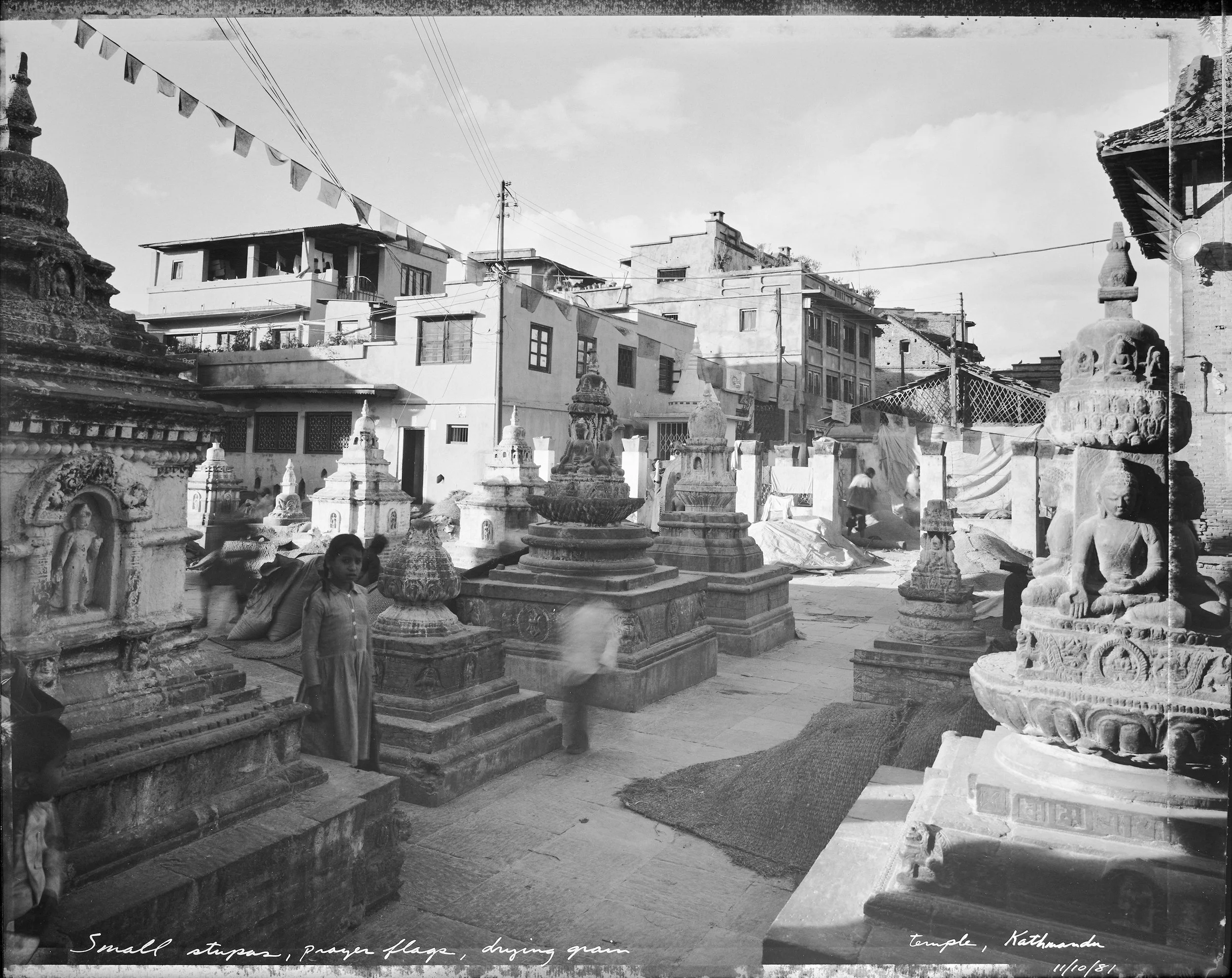  Small stupas, prayer flags, drying grain Tempe, Kathmandu   (11/10/81)