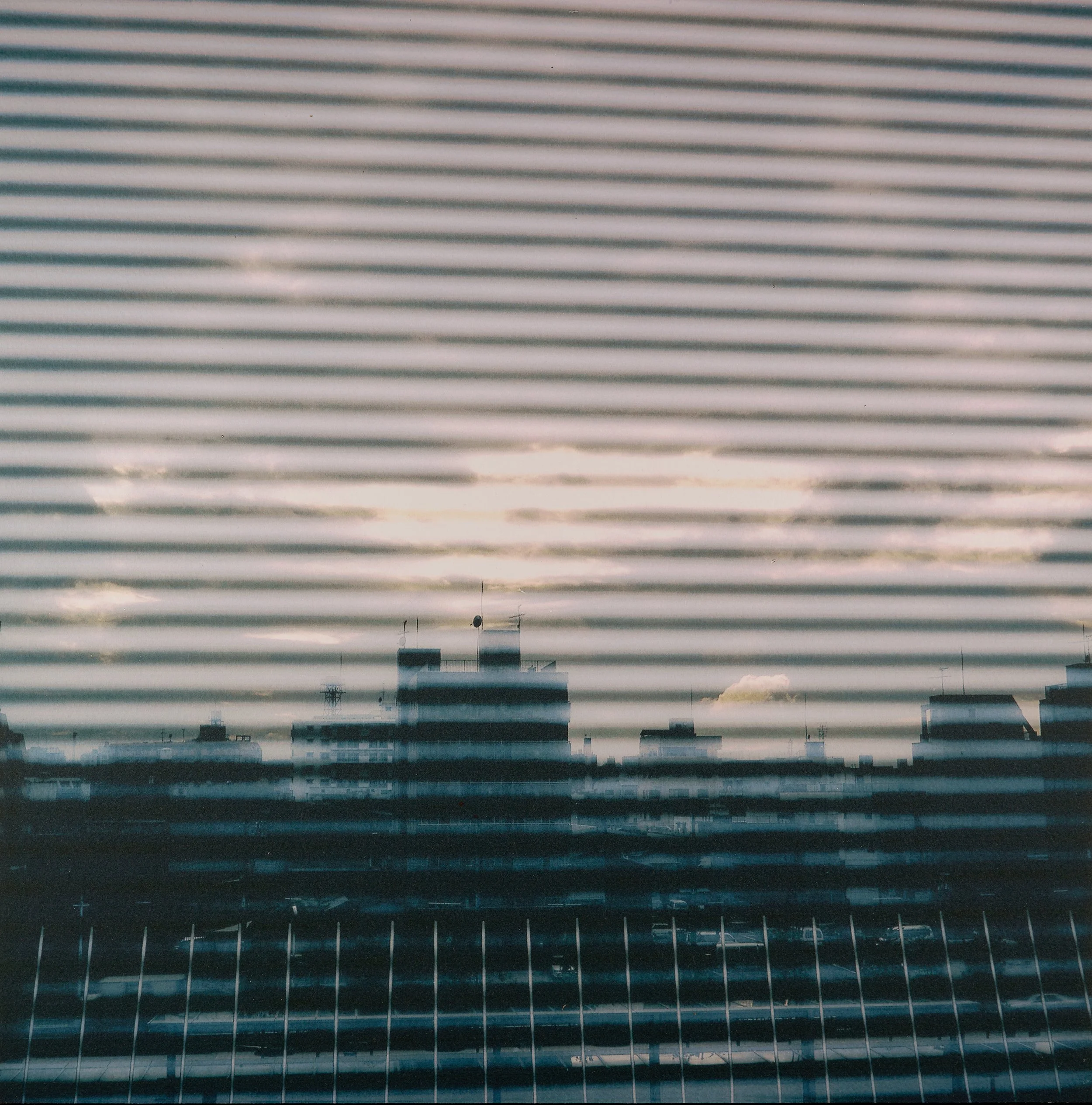 City thru window blinds.jpg