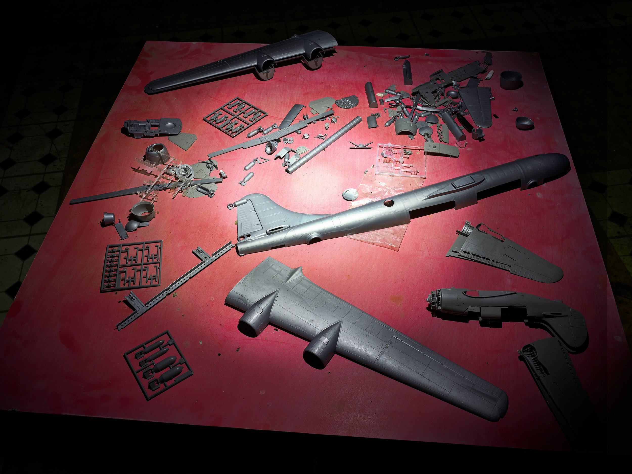  Unassembled plastic model of a B29 bomber left on a table in a former dive operation’s kitchen, Bikini. 
