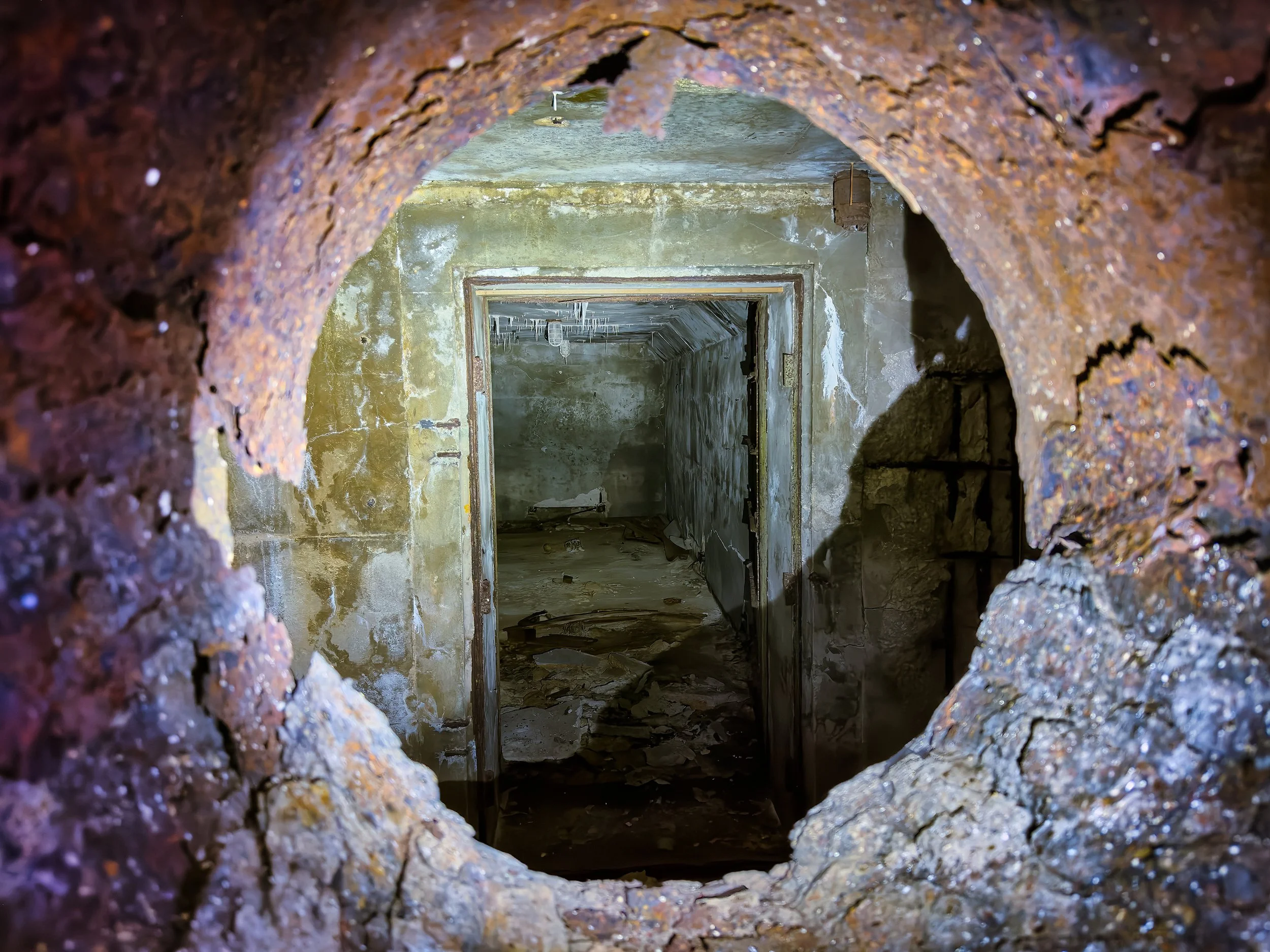  Looking through a porthole into a room in “Bunker 1200,” built to monitor the effects of a thermonuclear device, Nam island. 
