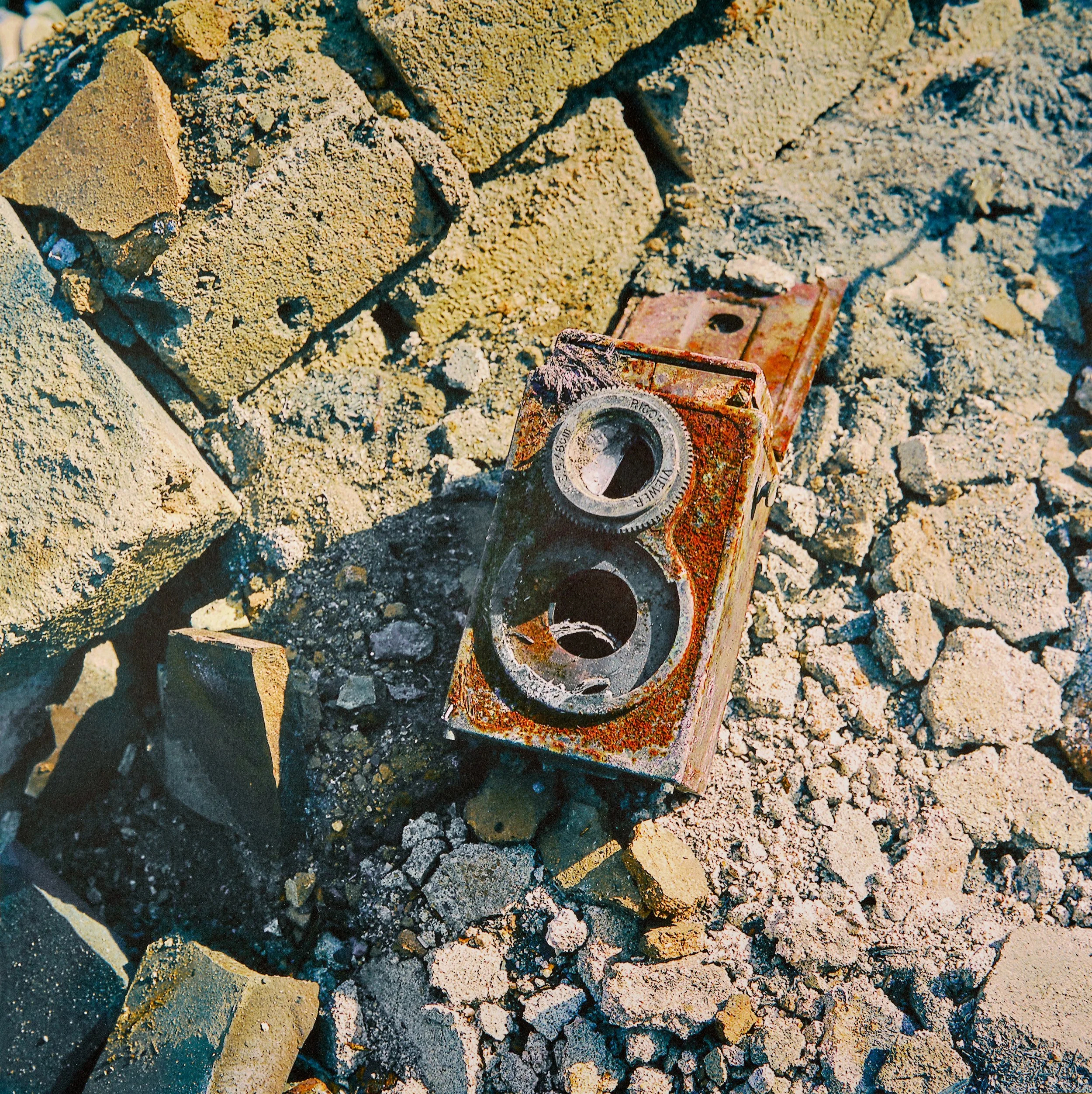 Burned camera in rubble.jpg