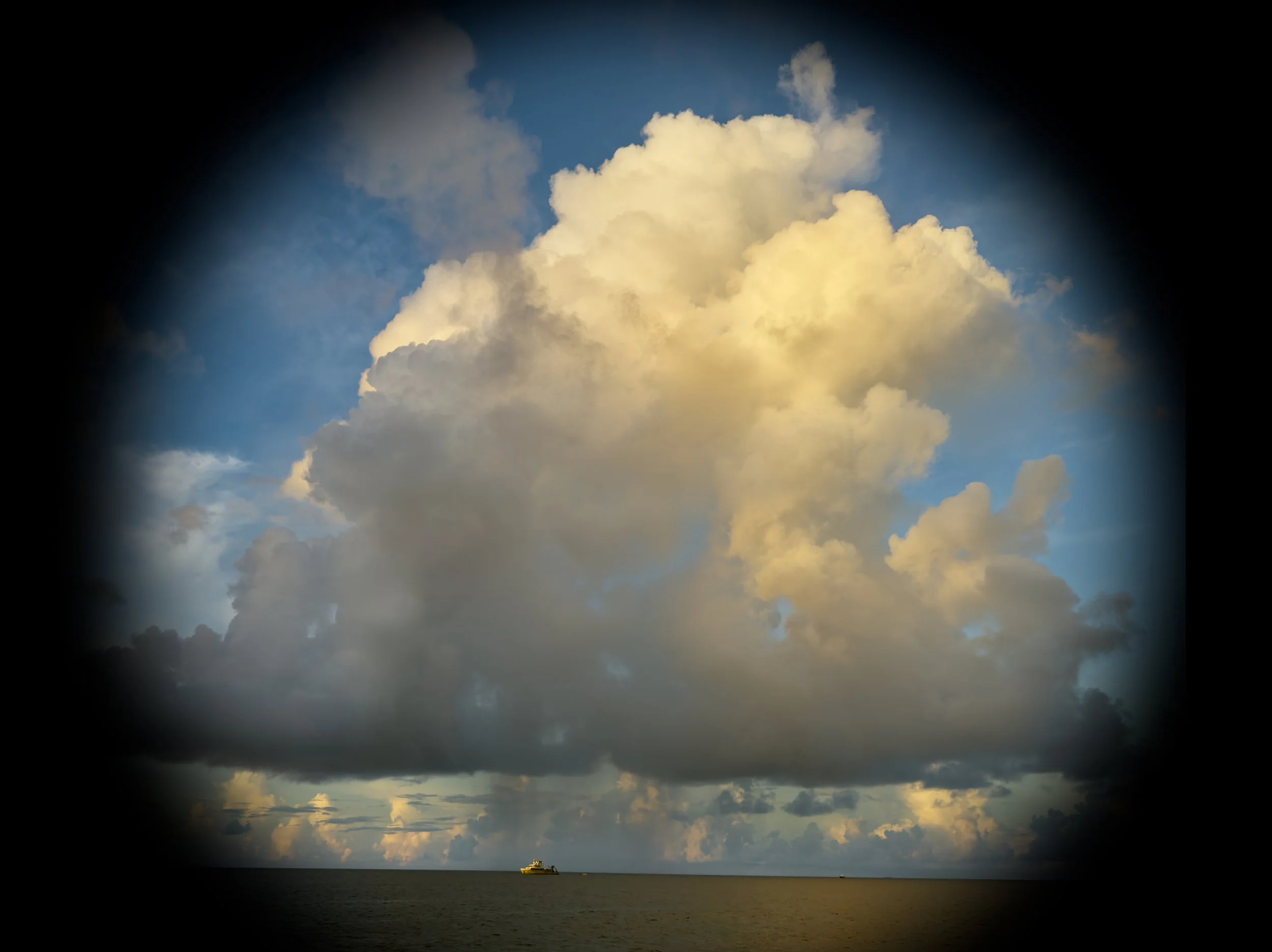  Discovery and morning clouds above Bikini lagoon. 
