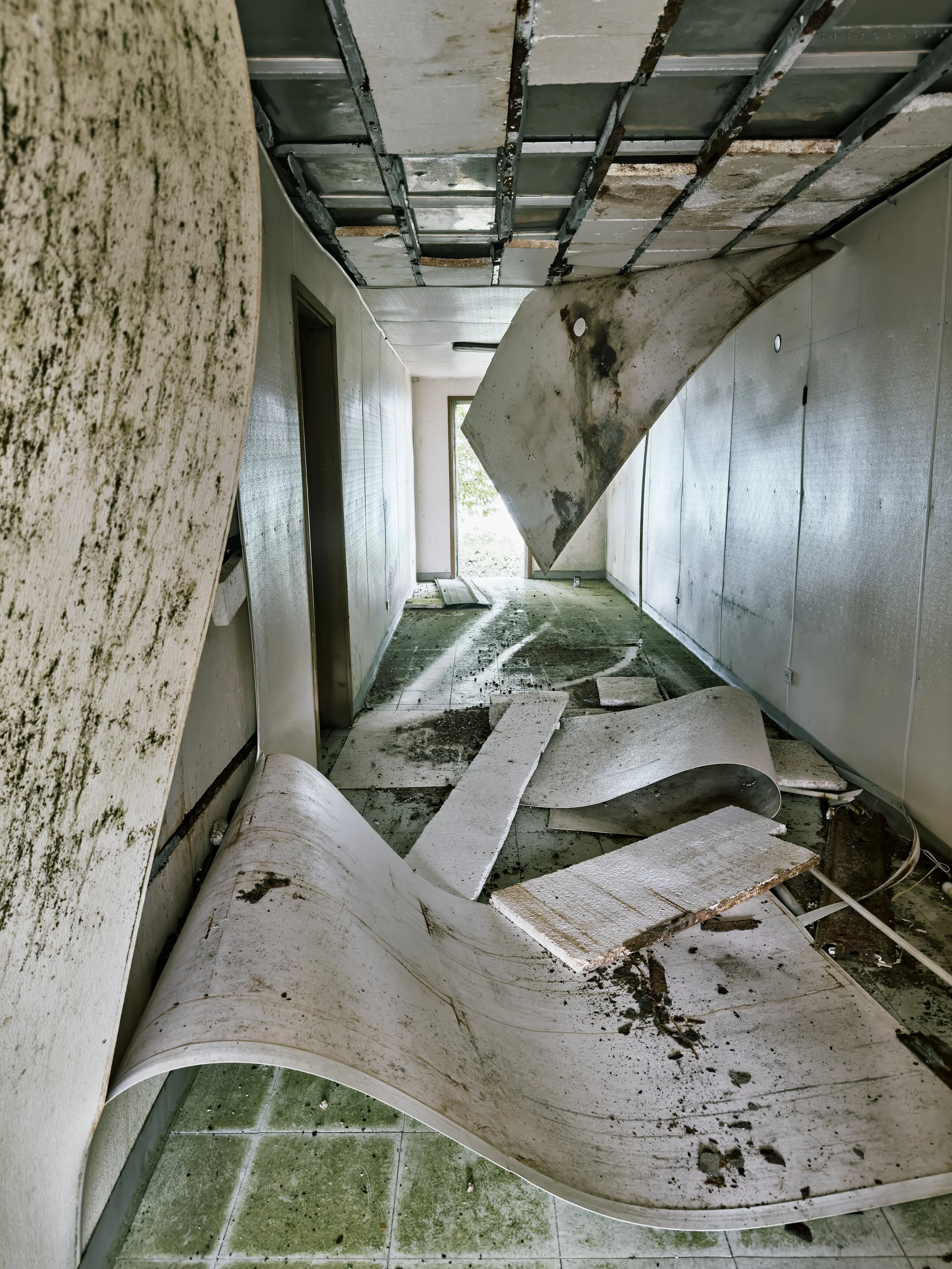  The ceiling and walls falling in at a storage structure on Bikini. 