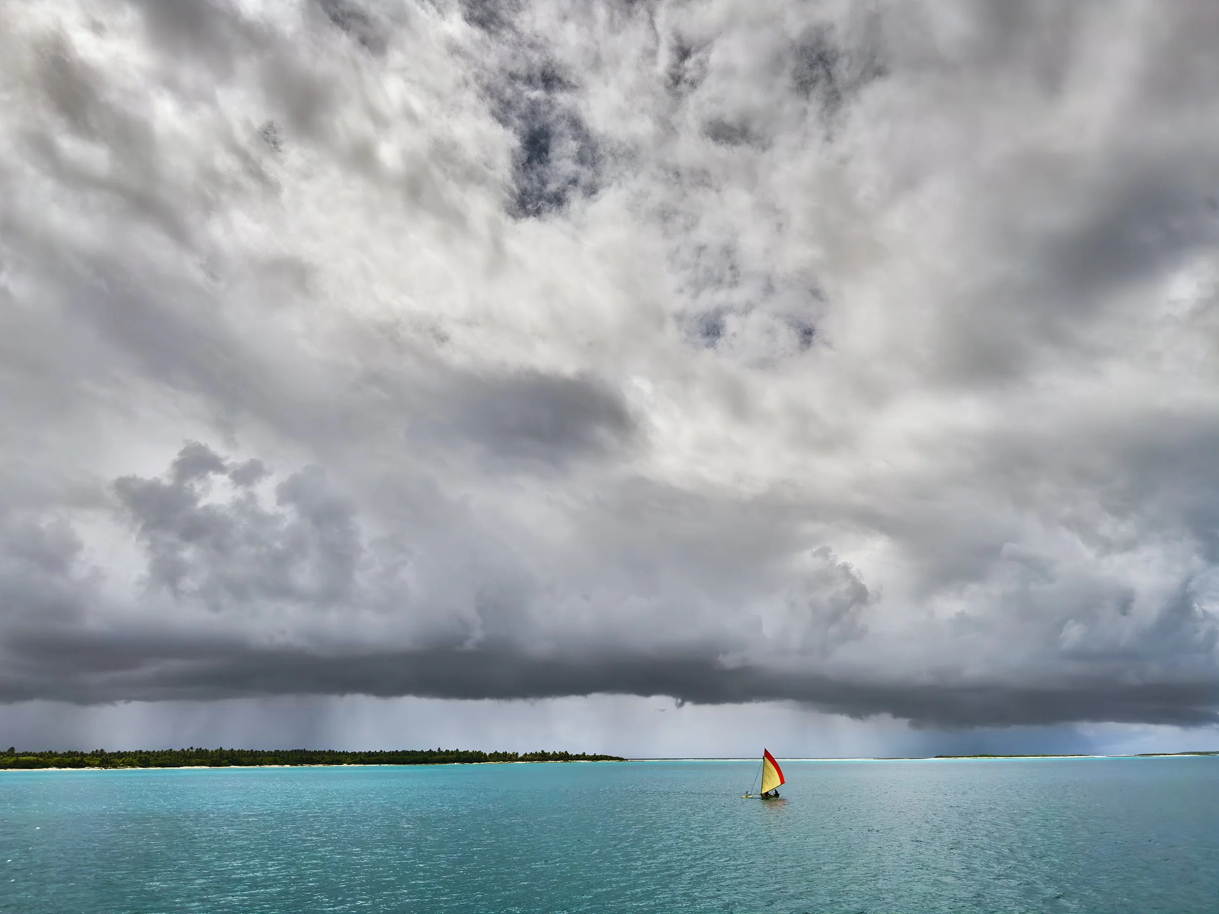  The canoe built by Alson Kelen and builders at WAM, sailing in Bikini lagoon. The canoe was transported to Bikini and intentionally left on the island’s beach. 