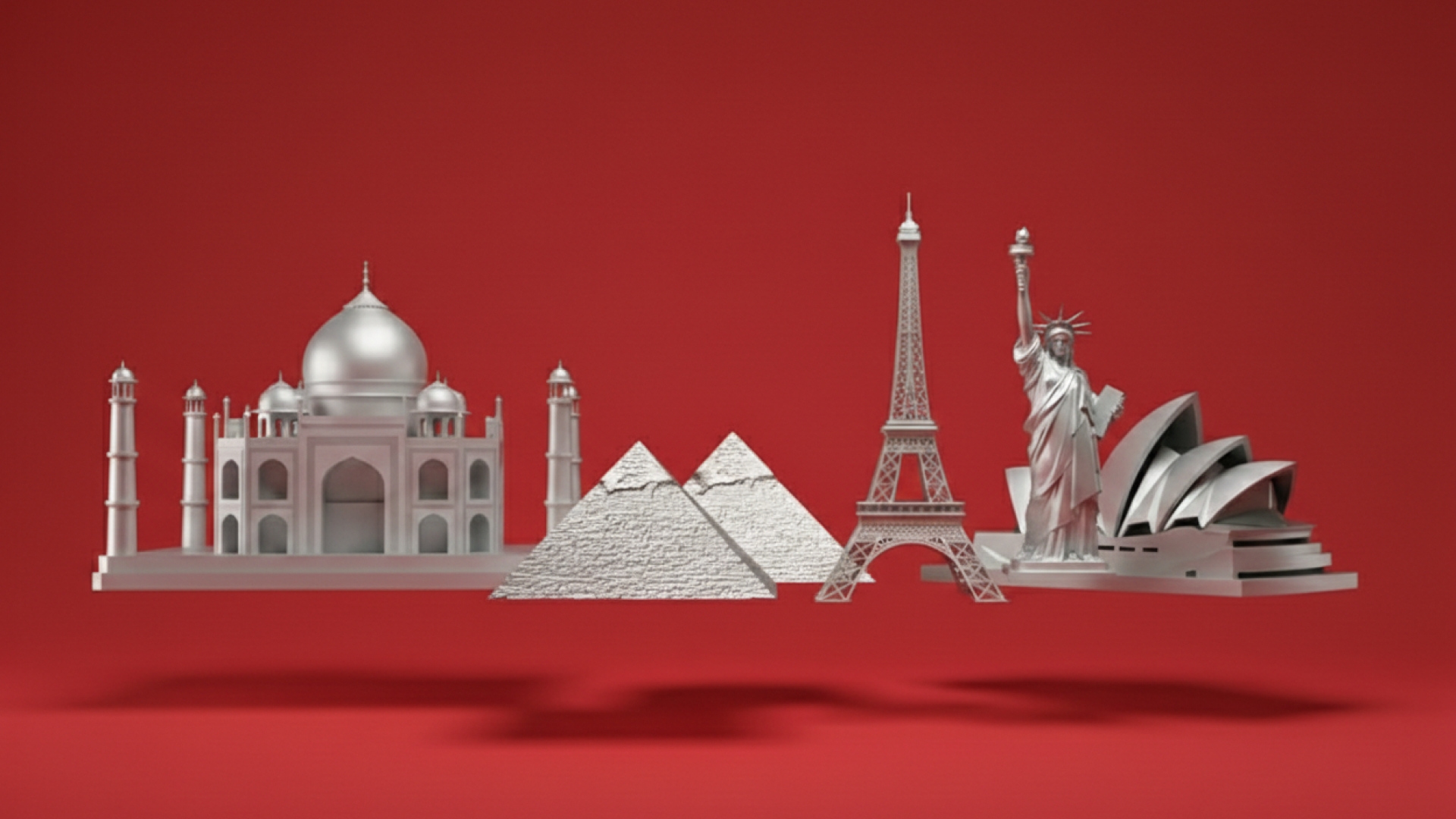 Silvery models of world landmarks including the Taj Mahal, pyramids, Eiffel Tower, Christ the Redeemer, and Sydney Opera House against a red background.