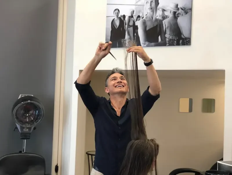 Danne Todt hairstylist cutting hair at Infuse Hair Salon in Honolulu