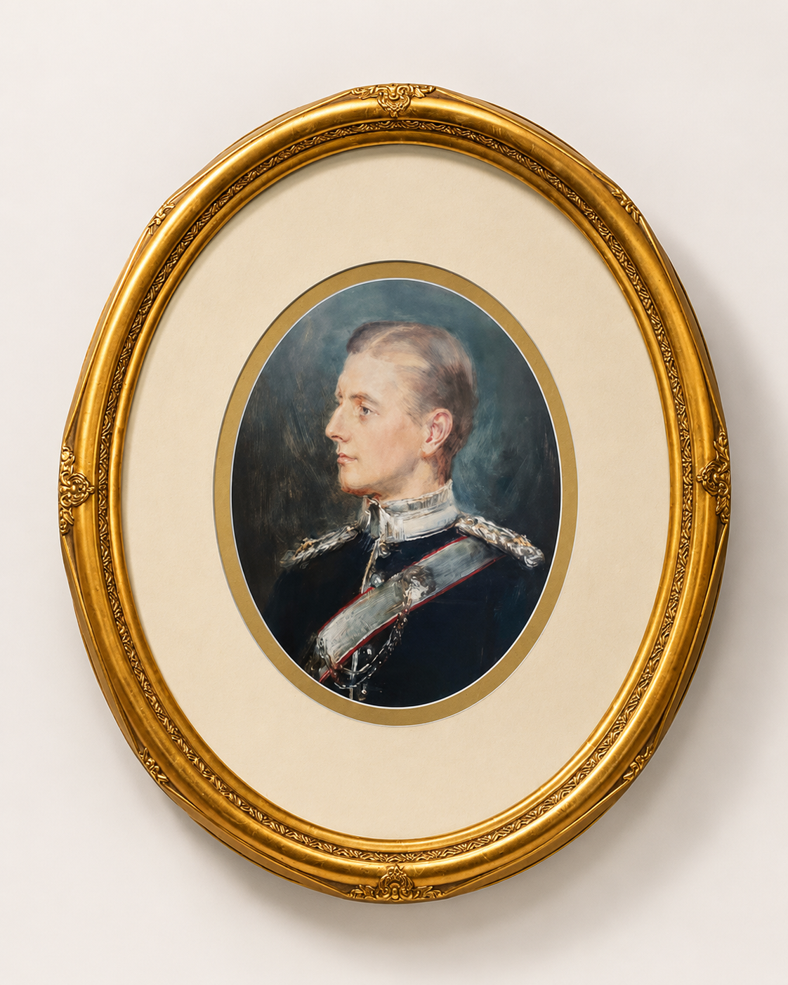 Portrait of a man in a military uniform with a gold ornate frame.