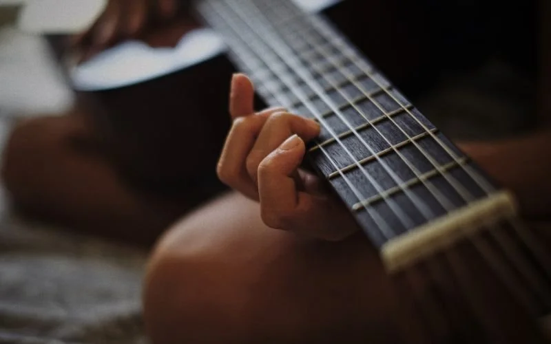 Which songs should I start with on the guitar?