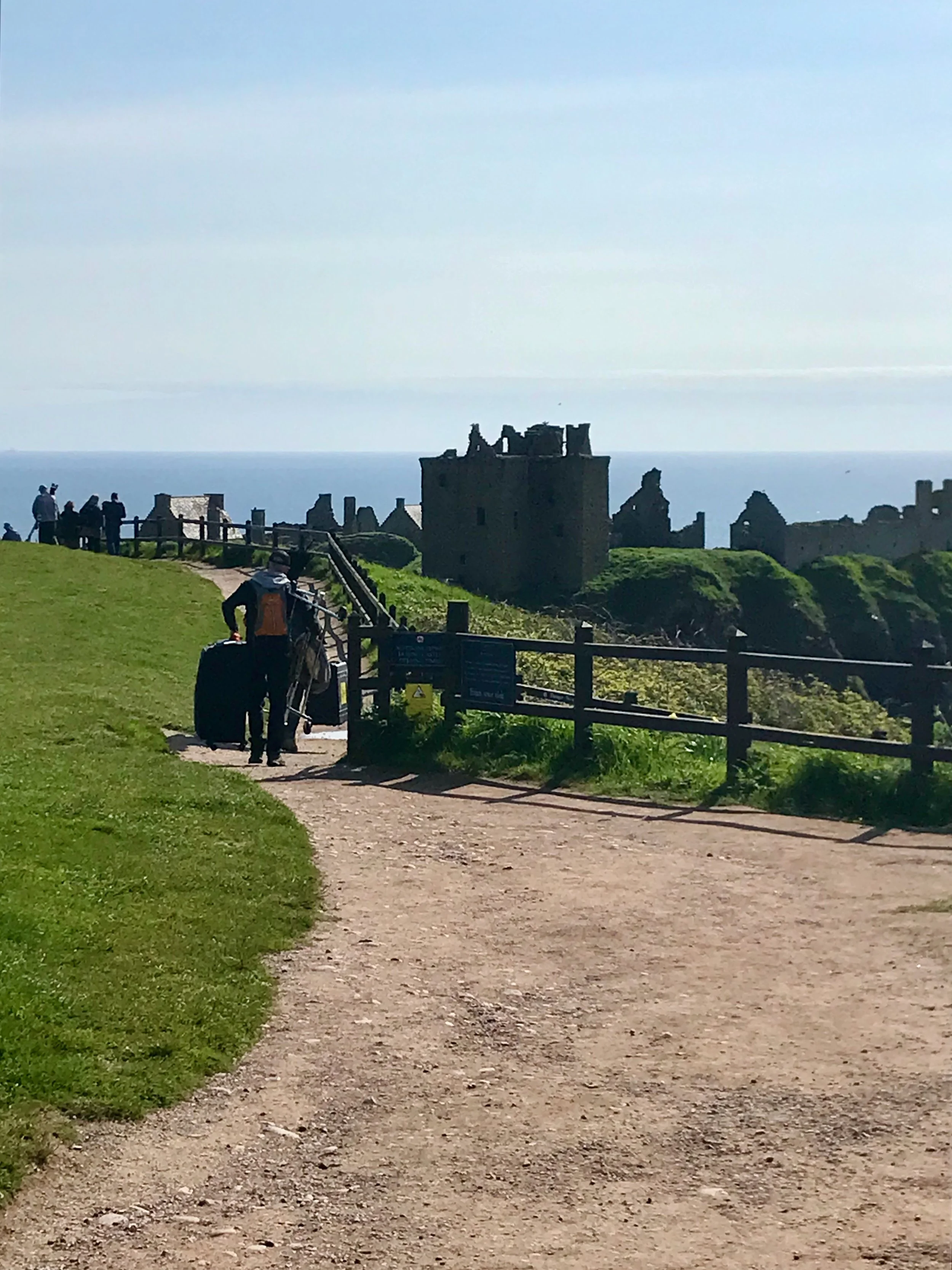 Photo shoot crew in front of Dunnottar Castle Aberdeen