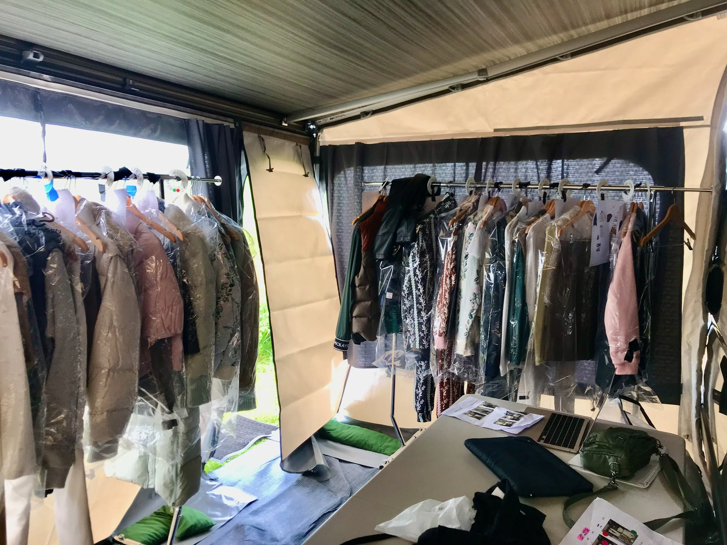 Collection of clothing on rails in privacy room