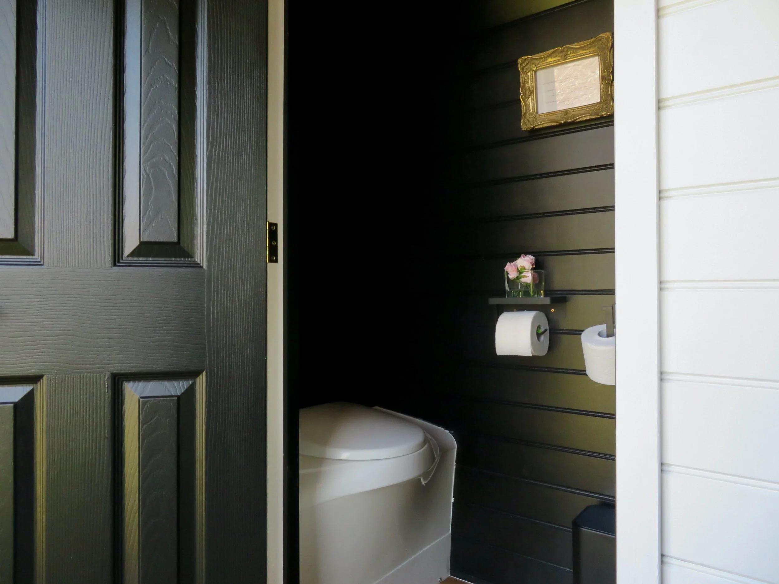 Thetford toilet and balck wood panelling