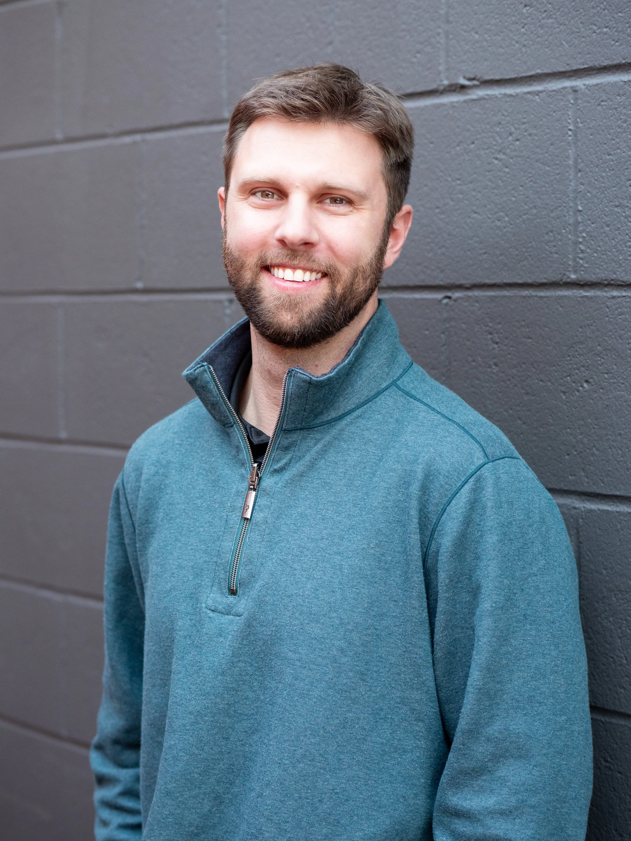 Silhouette of a person with short hair, facing forward.