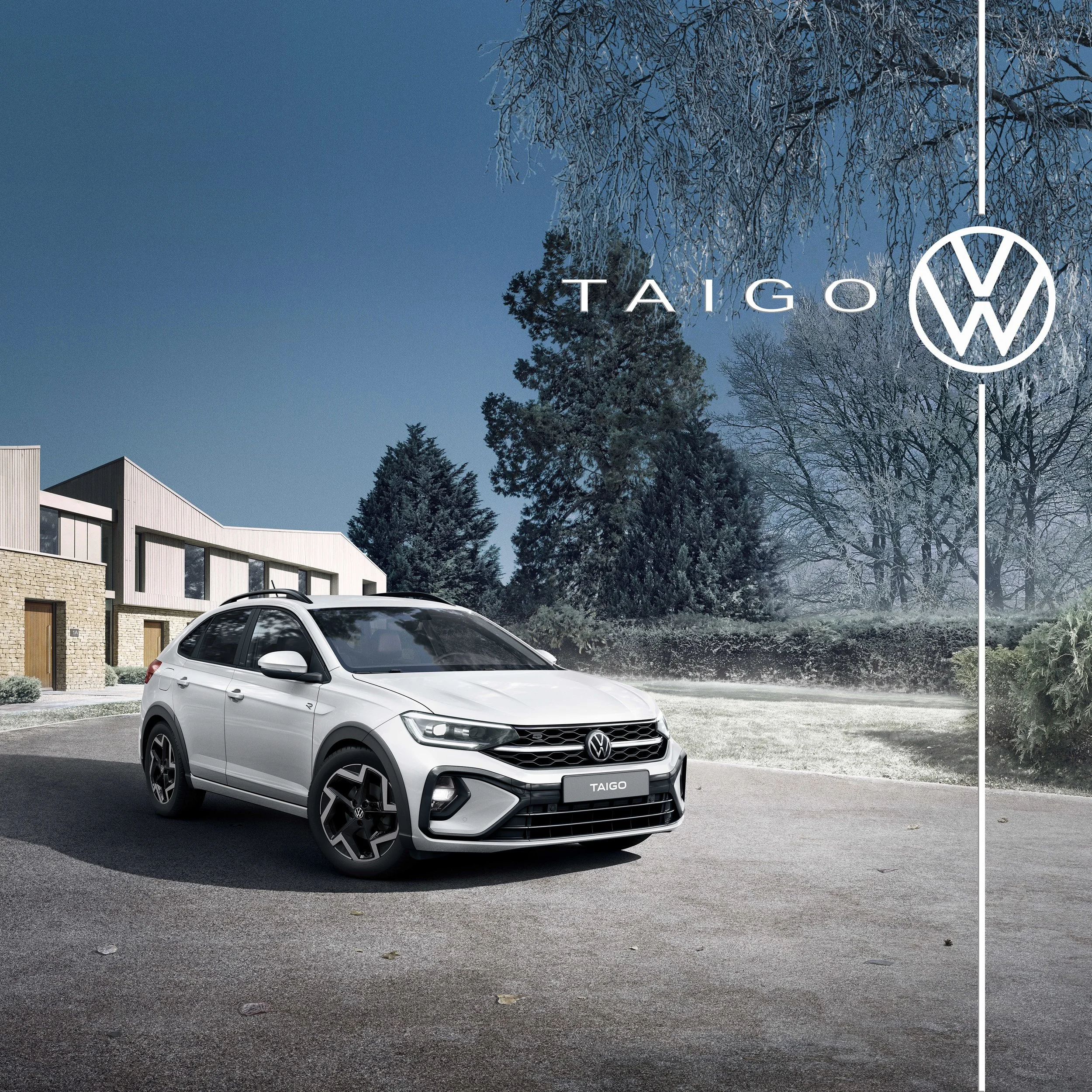 A white Volkswagen Taigo parked in front of modern houses and trees with winter branches, under a clear blue sky.