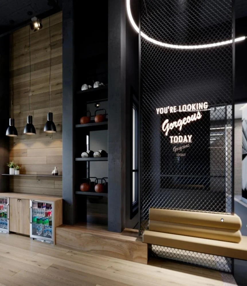 Modern interior with a wooden wall, black shelves with kettlebells, a gold bench, neon sign that reads 'You're looking gorgeous today', and mini refrigerator under the shelf.
