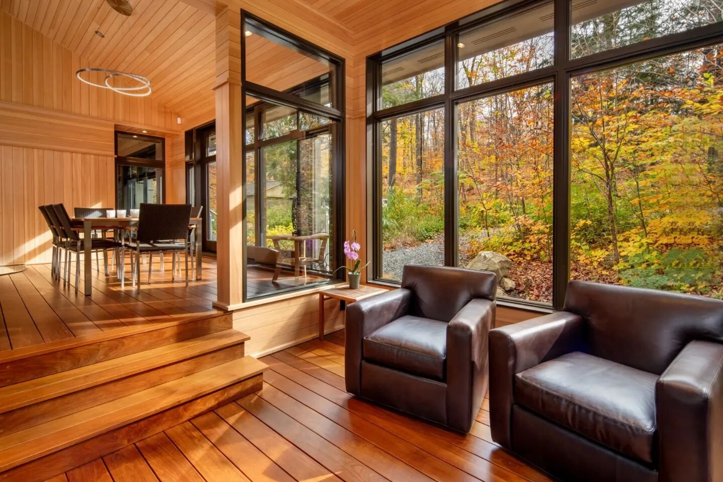 Warm and welcoming interior with an incredible view of the autumn woods. 
.
@tamaracknorthltd.
.
.#architecturalphotographer #architecturalphotography #comercialphotography #marketing #photographer #interiordesign #custombuilder #cottage #luxuryhomes