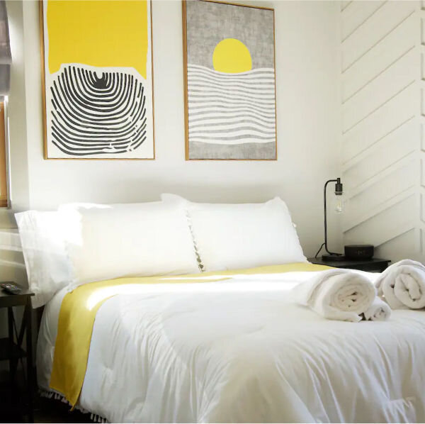 A little yellow pop, dare we say, in the bedroom at this Decatur, GA airbnb. The yellow is a neat trick to grab your attention when scanning properties to rent. If you are reading this caption, then you already know. 

Photo care of @airbnb