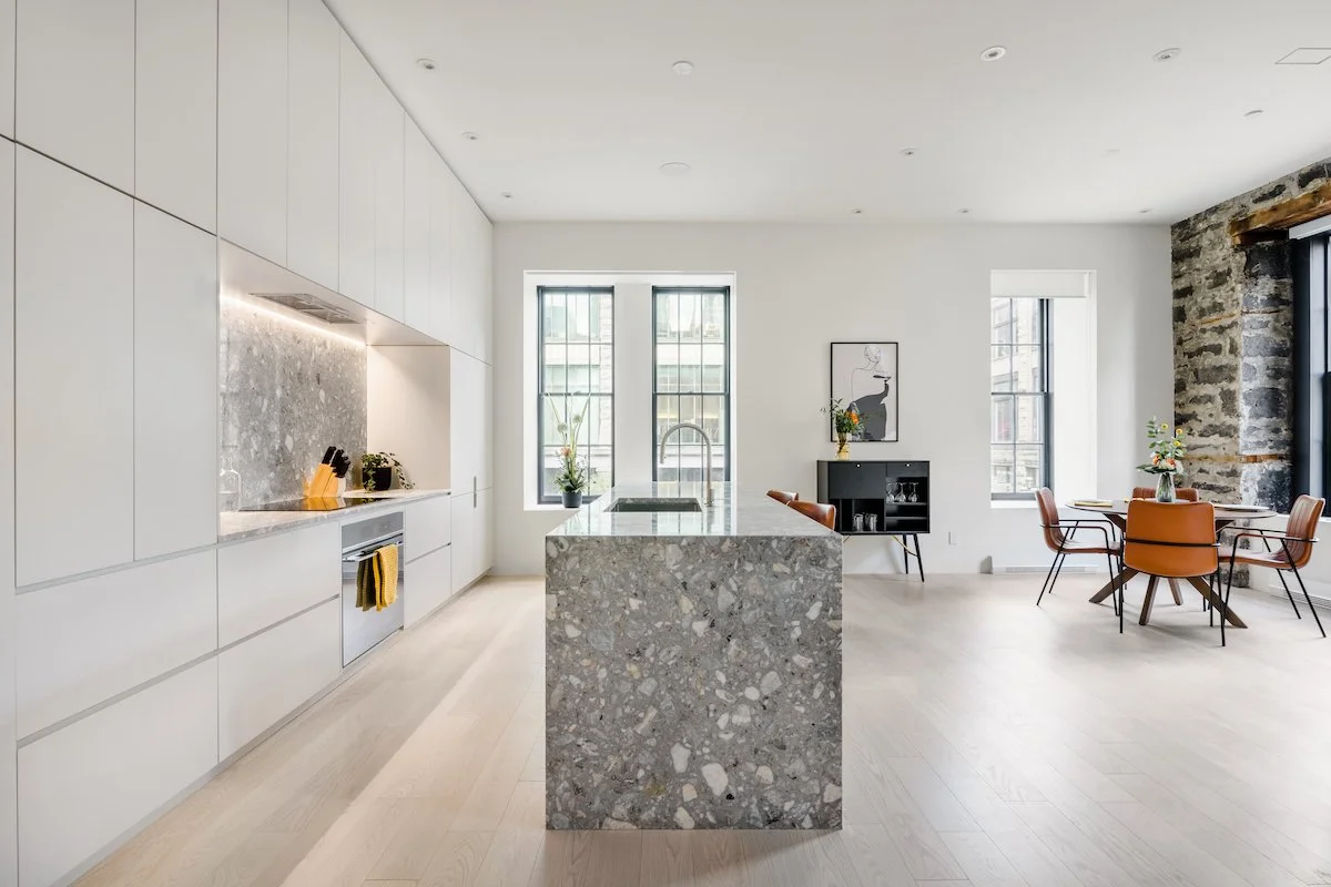 Fülhaus Channels a Luxury Penthouse's Architectural Charm Through Modern Design — interior design for luxury short-term rental owners
