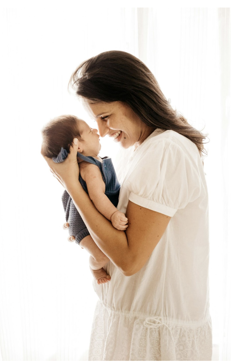 mom holding baby